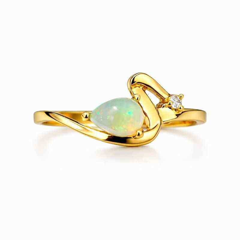 White Ethiopian Opal pear ring featuring a 4x6mm teardrop gemstone set in sterling silver, handmade jewelry for women.