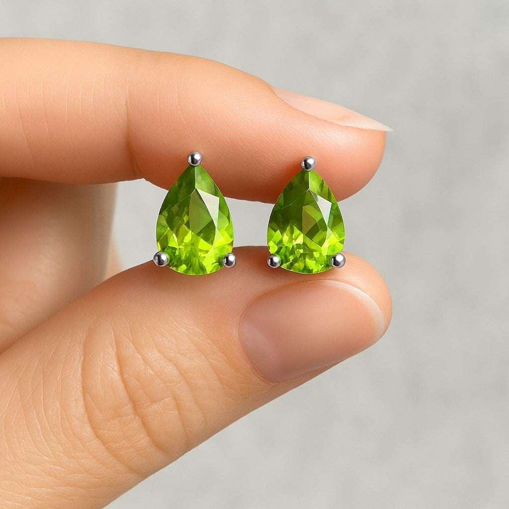 Natural Peridot pear-shaped stud earrings in 925 sterling silver, showcasing tiny green gemstone earrings for women.