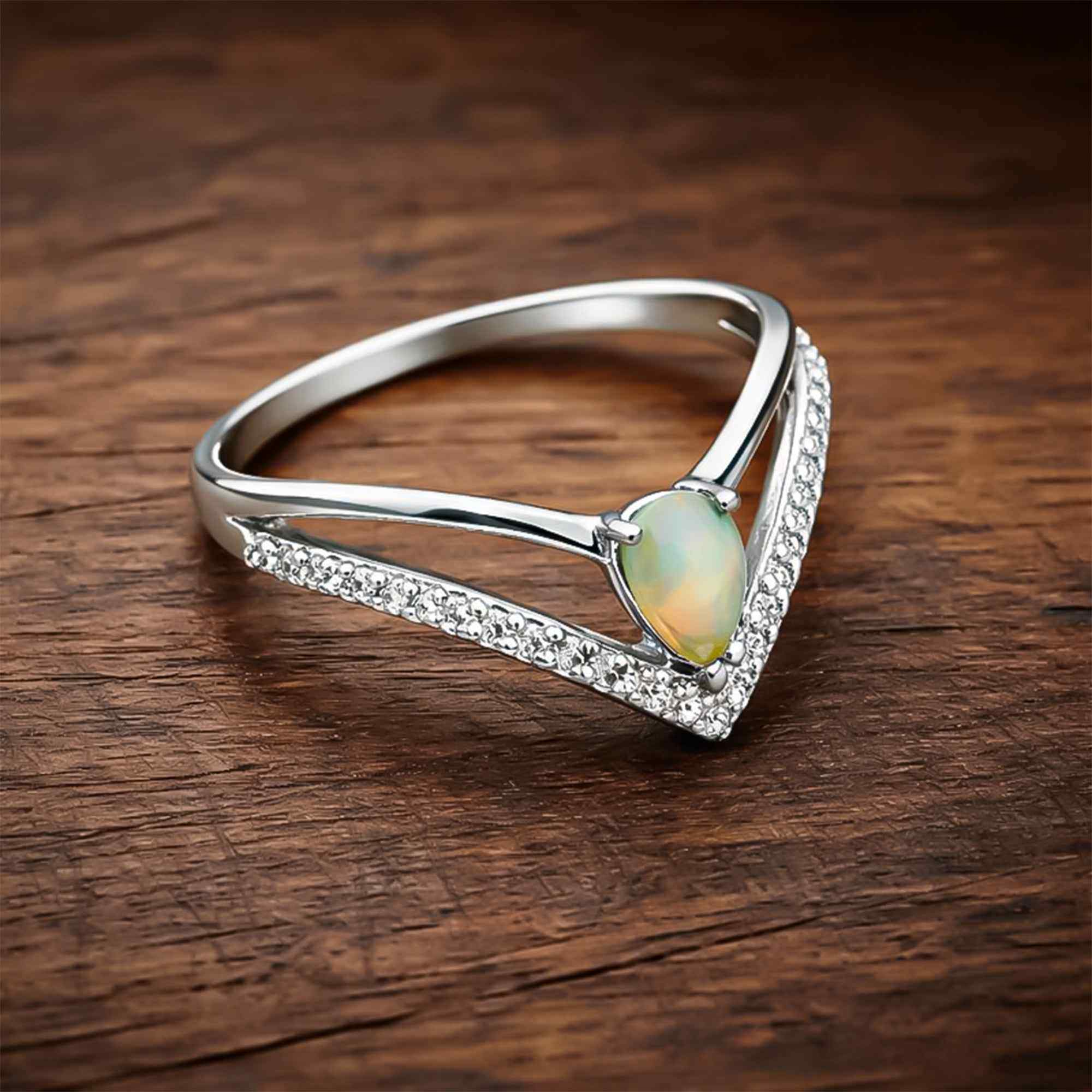 Ethiopian Opal Ringwith 4x6mm pear cabochon set in sterling silver, handmade elegant jewelry for women.