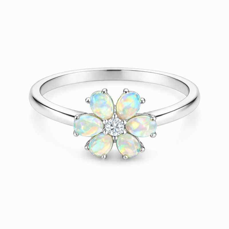 White Ethiopian Opal zircon ring with 3x5mm oval cabochon in sterling silver halo style jewelry by Himalya Quartz.