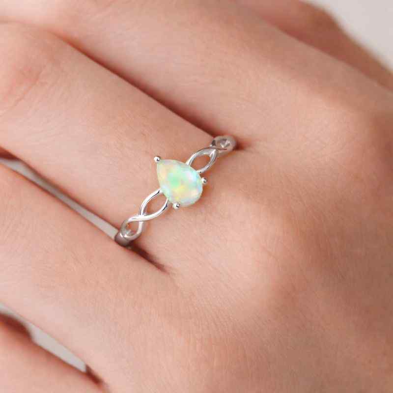 Pear-shaped white Ethiopian Opal Ringwith 4x6mm opal set in sterling silver band, handcrafted teardrop jewelry for women.