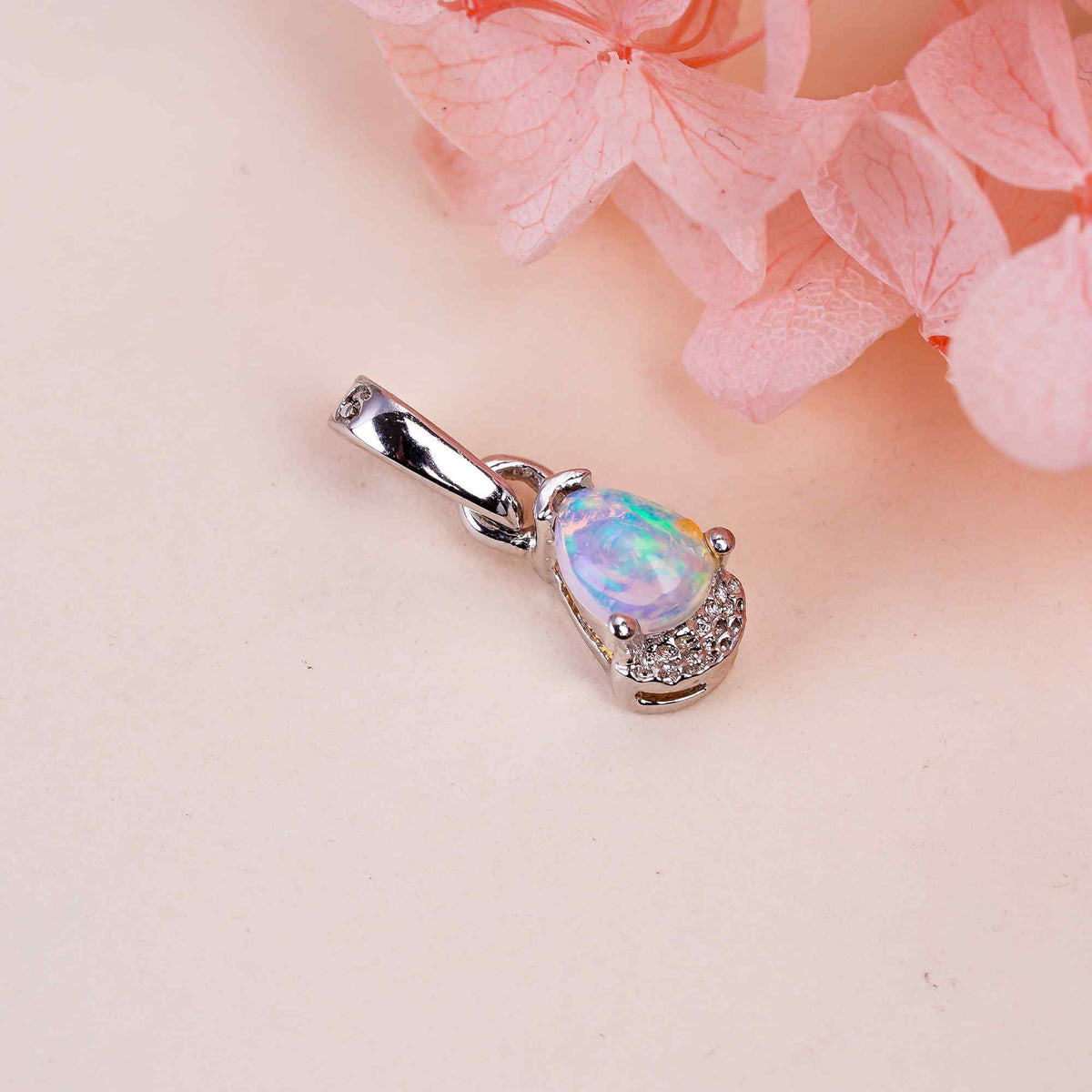 Natural opal pear pendant on 925 sterling silver chain by Himalya Quartz, minimalist design perfect for elegant jewelry.