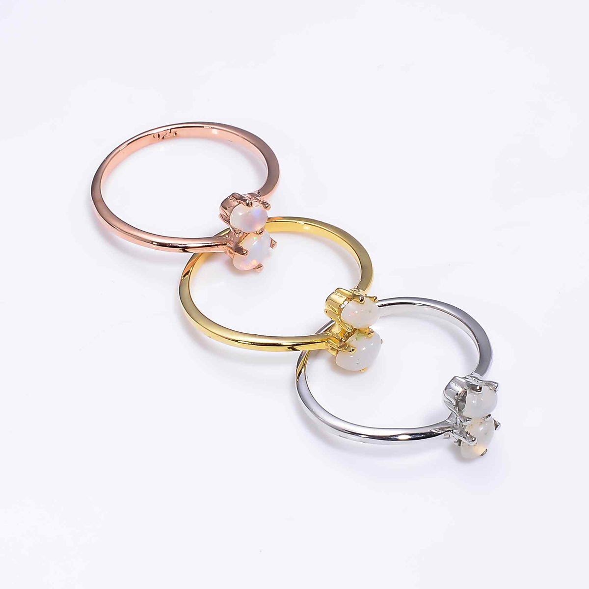 Natural Ethiopian Opal oval ring in 925 sterling silver with a 3x5mm opal, minimalist design, perfect as a women's promise ring.