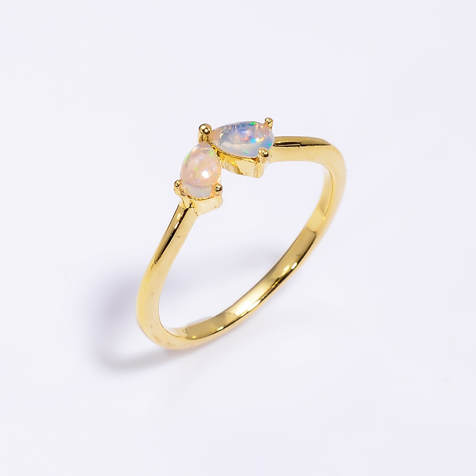 Ethiopian Opal ring featuring a 3x5mm teardrop opal set in sterling silver, minimalist handmade design for women.