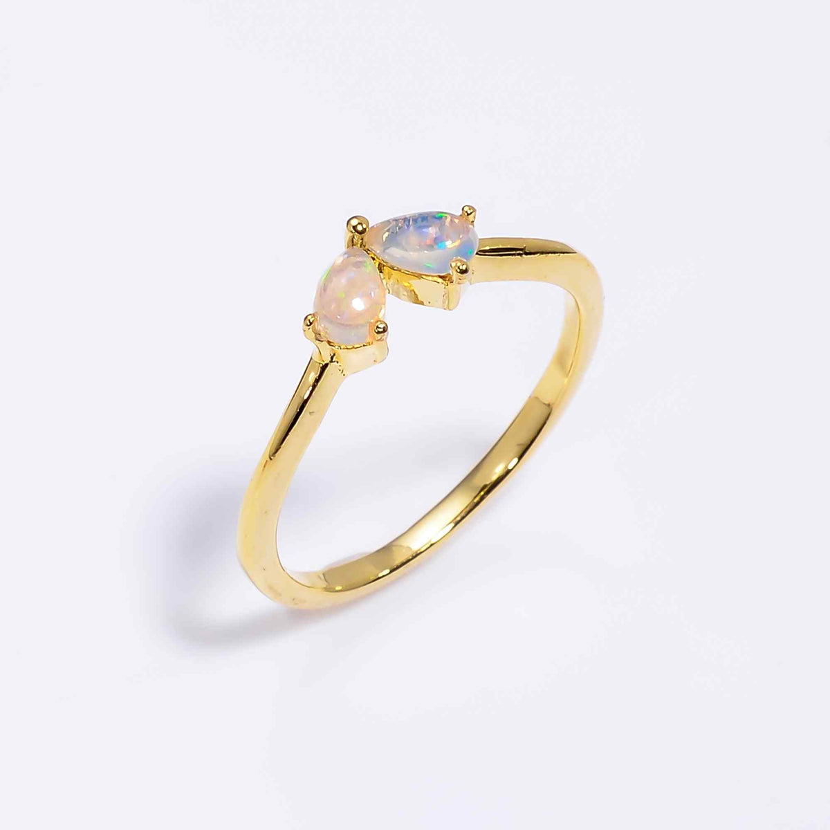 Ethiopian Opal Ringfeaturing a 3x5mm teardrop opal set in sterling silver, minimalist handmade design for women.