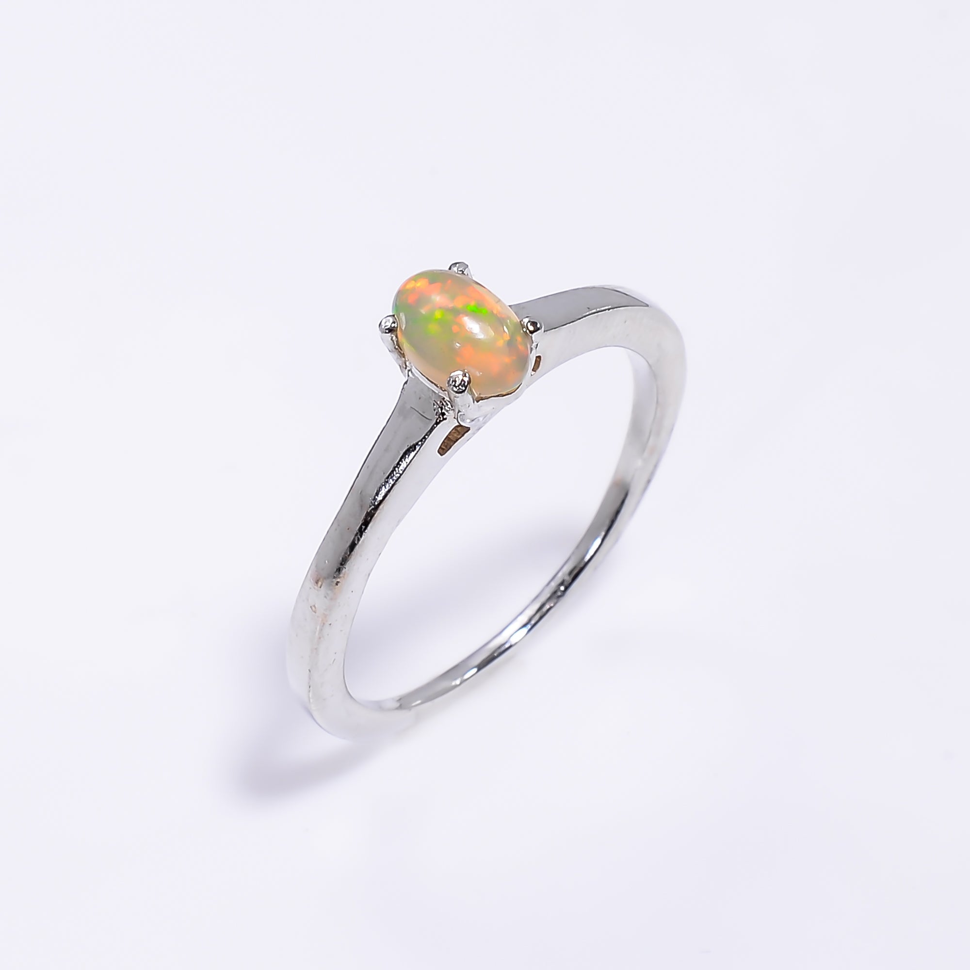 Ethiopian opal ring in 925 sterling silver with oval 4x6mm gemstone, designed for women, by Himalya Quartz.