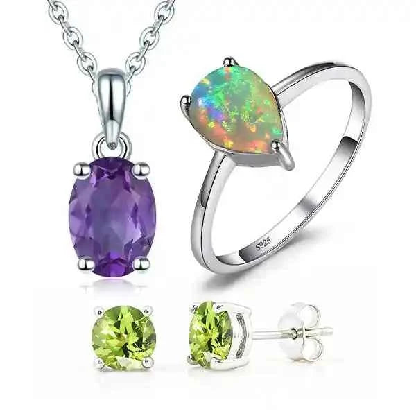 Jewelry set with pendant, ring, and earrings on a white background