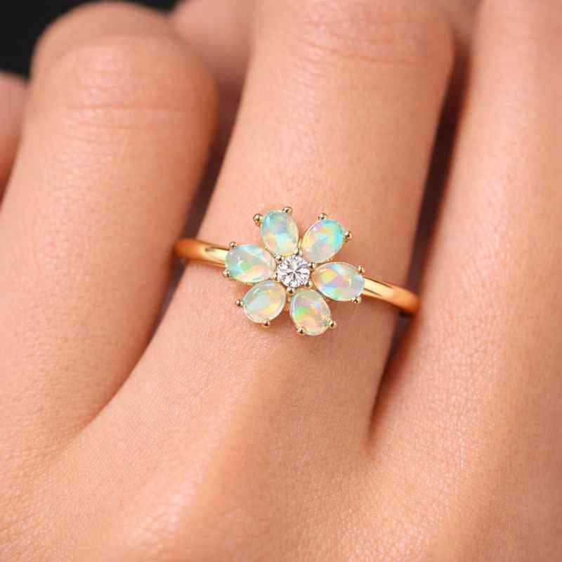 White Ethiopian Opal zircon ring with 3x5mm oval cabochon in sterling silver halo setting, jewelry by Himalya Quartz.