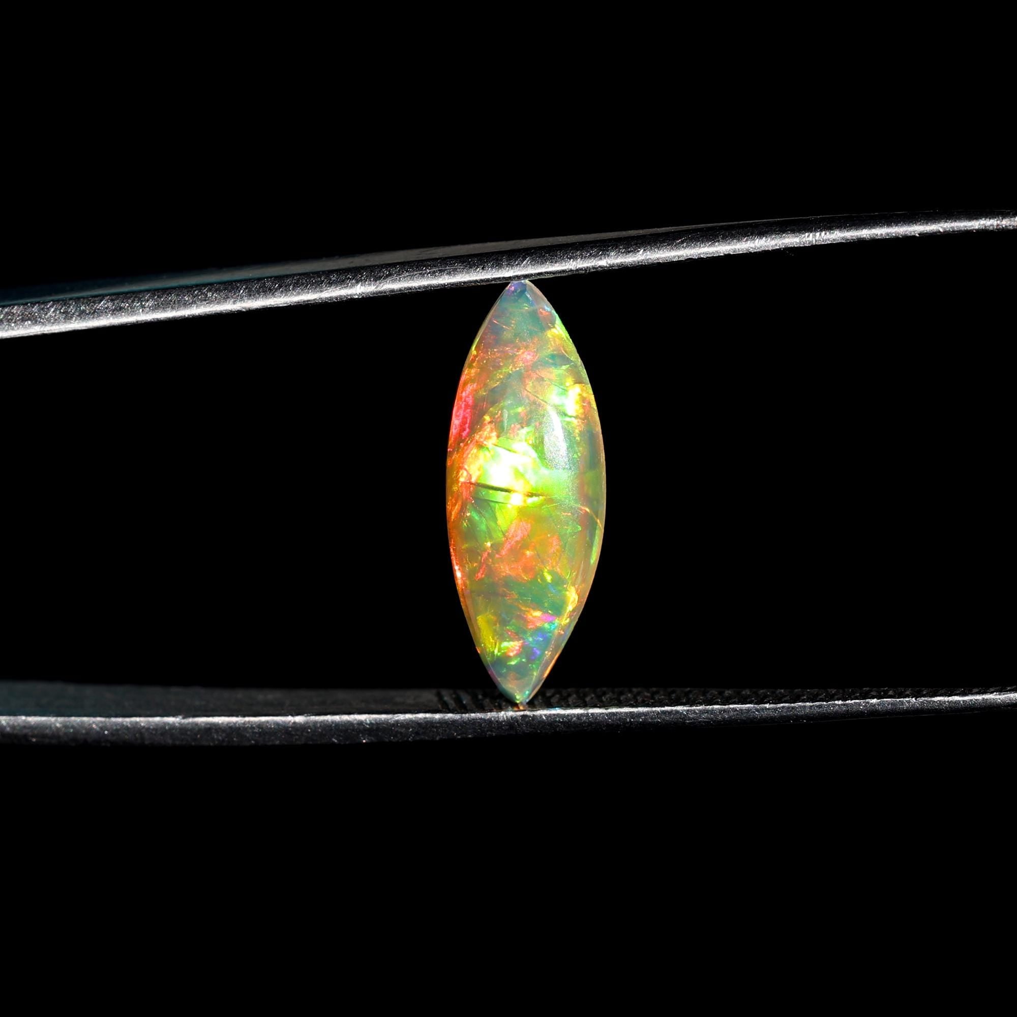 Milky White Ethiopian Opal Gemstone: 1.60 Carat Marquise Cabochon