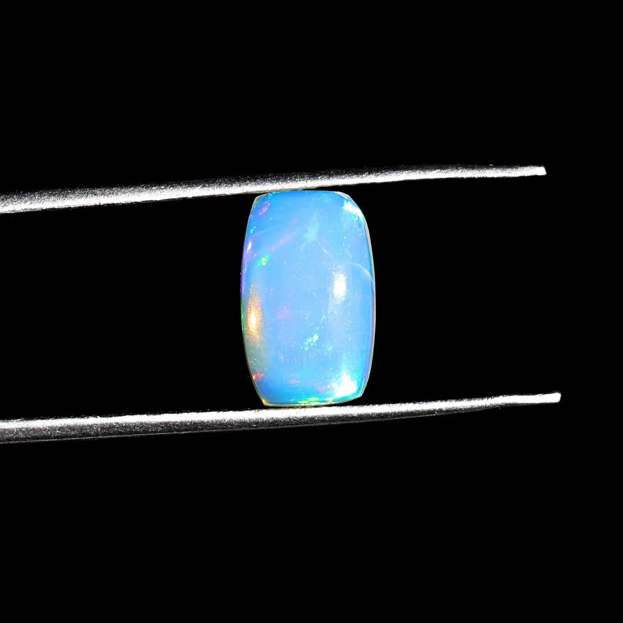 1.58 Carat Ethiopian Opal Gemstone: Rainbow Fire, Long Cushion Cabochon - Himalya Quartz