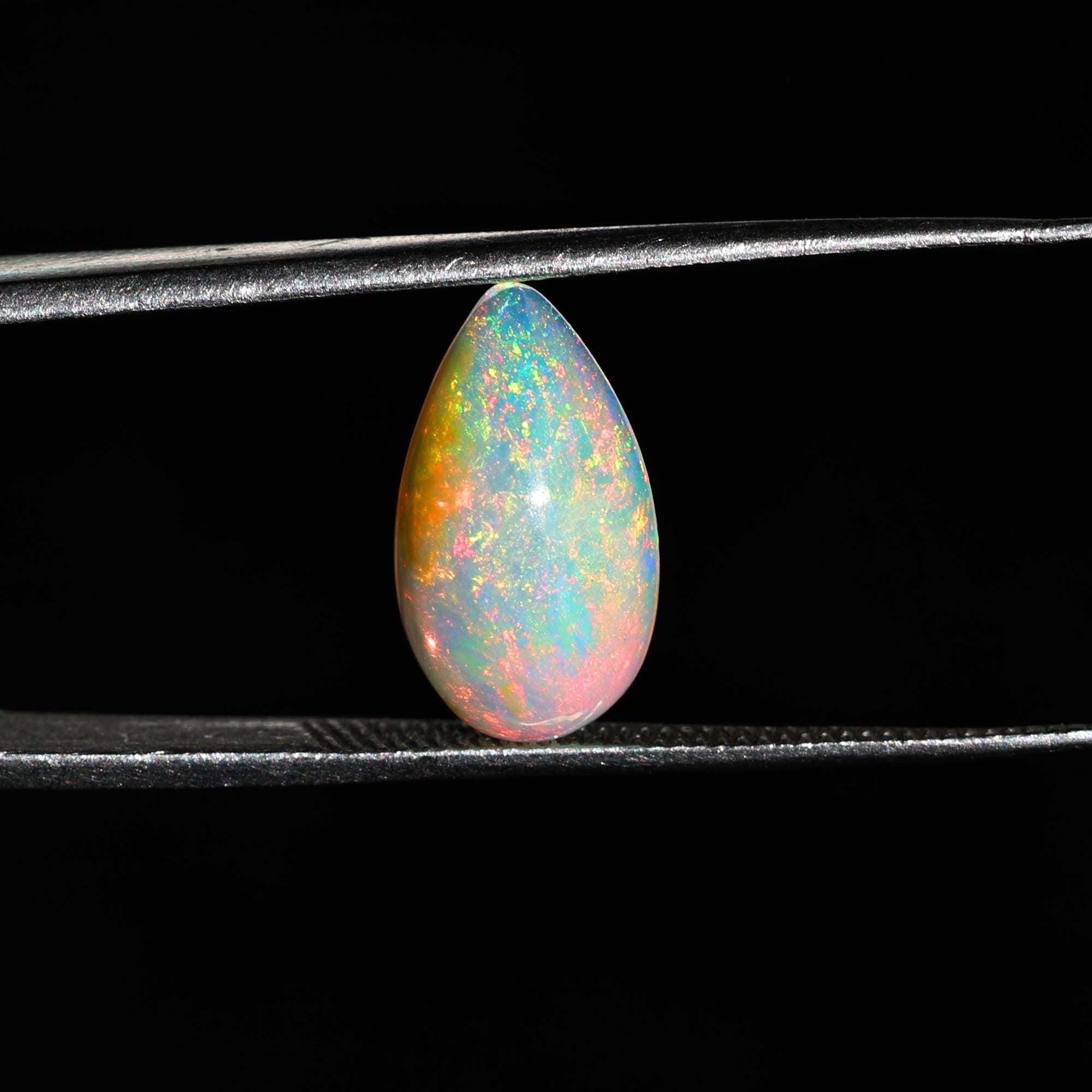 AAA+ Quality White Ethiopian Opal Cabochon: 2.25 Carat Pear-Shaped Gemstone
