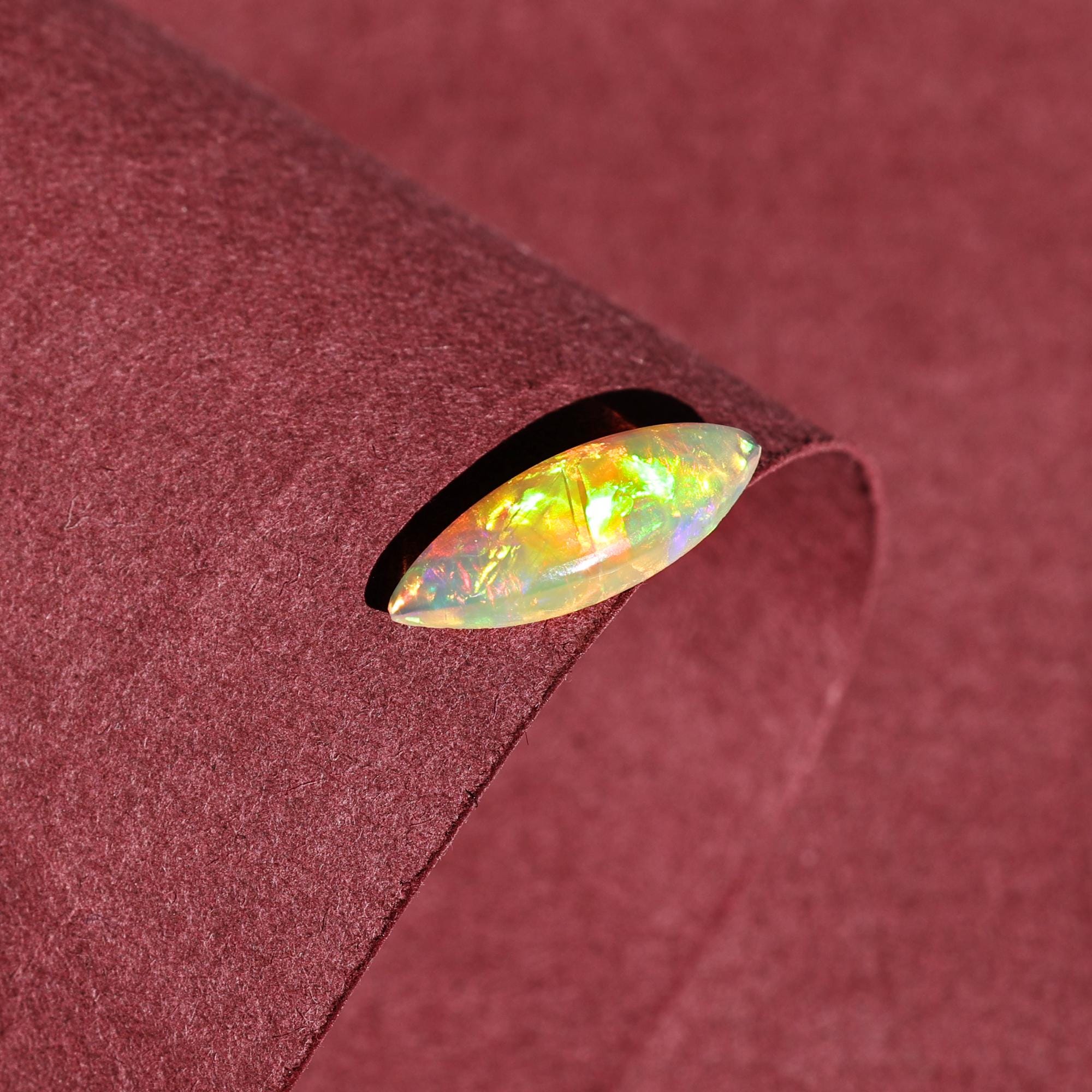 Milky White Ethiopian Opal Gemstone: 1.60 Carat Marquise Cabochon