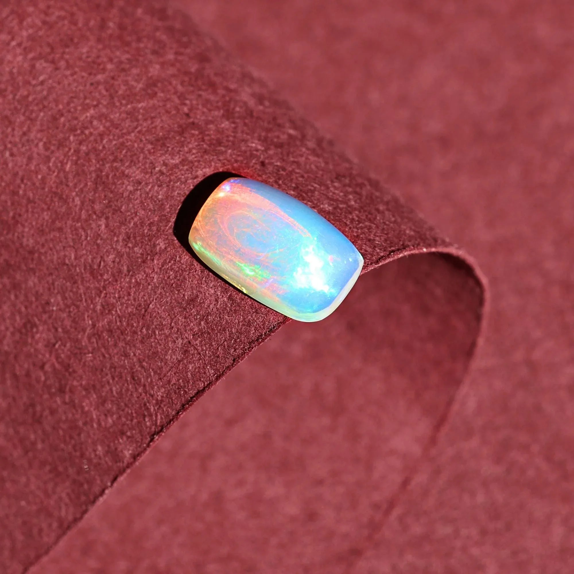 1.58 Carat Ethiopian Opal Gemstone: Rainbow Fire, Long Cushion Cabochon - Himalya Quartz