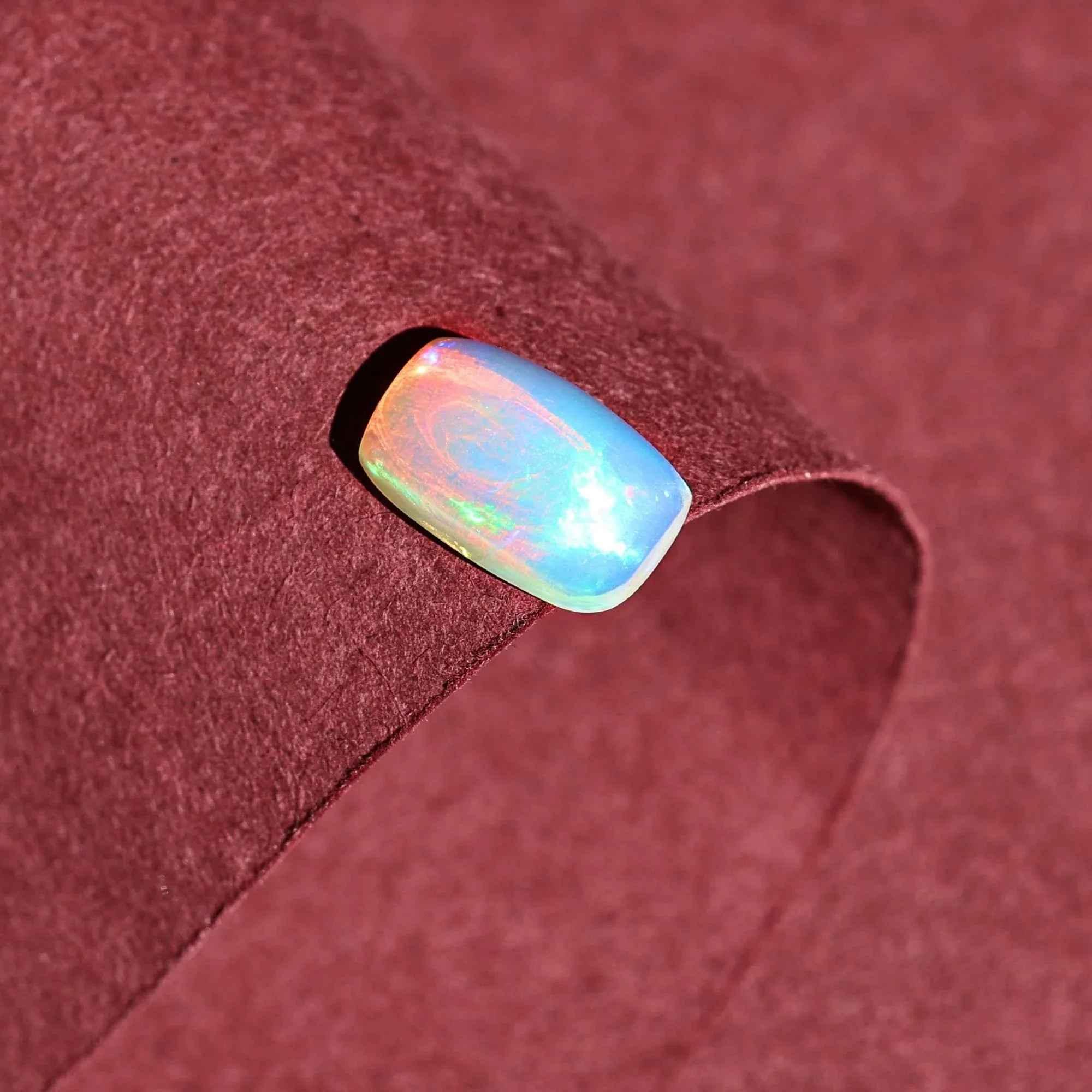 1.58 Carat Ethiopian Opal Gemstone: Rainbow Fire, Long Cushion Cabochon loose gemstones