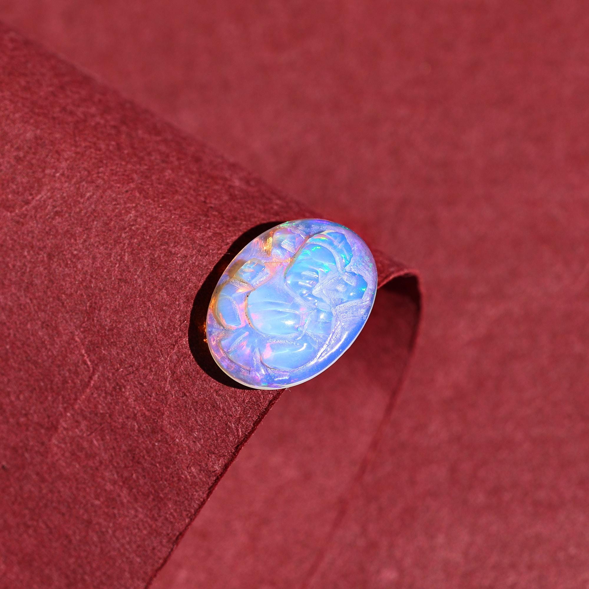 Ethiopian Opal Ganesha Carving: Divine Gemstone (12x16mm)