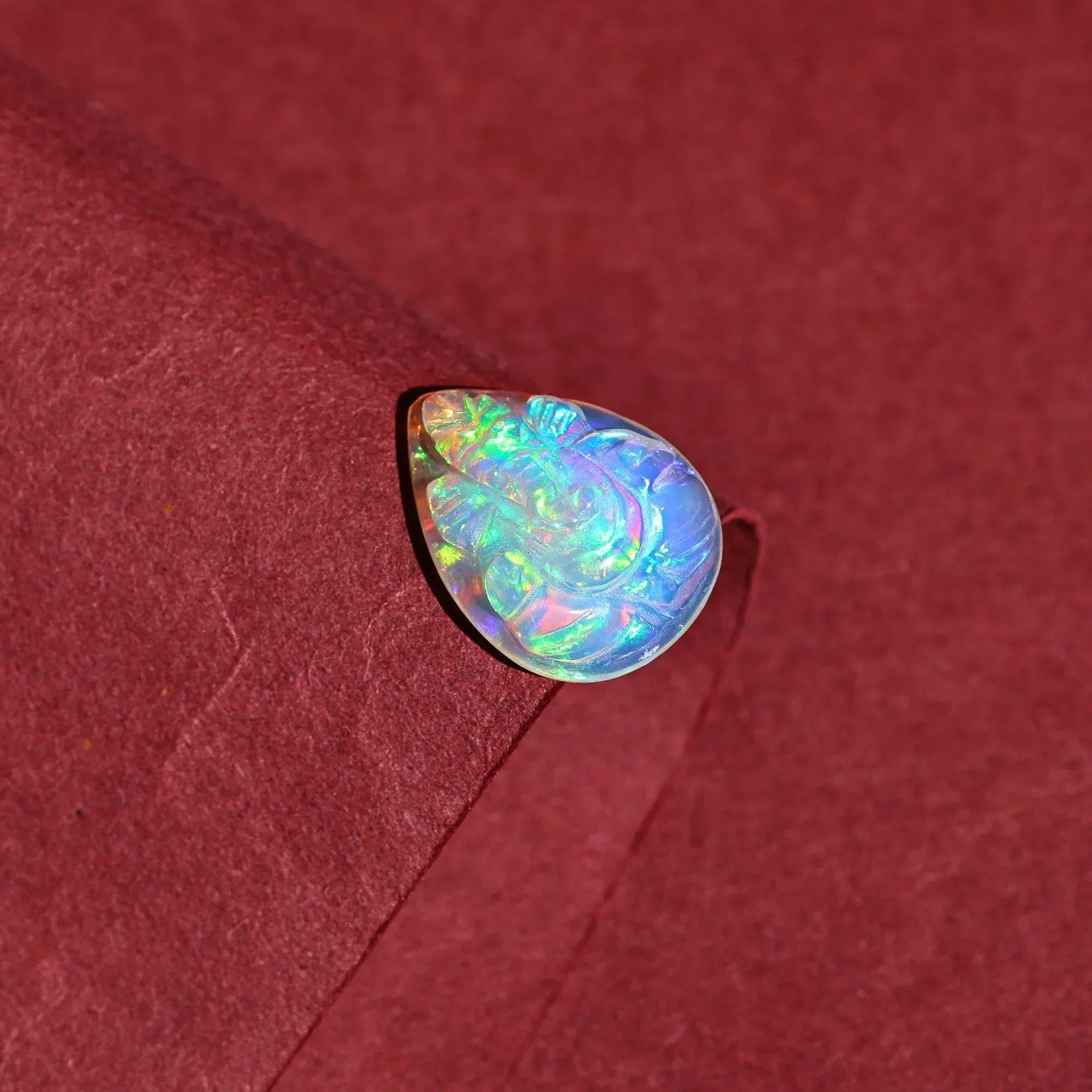 Hand-Carved Ethiopian Opal Ganesha Statue: Pear Shape Crystal Carving (5.60 Carat) loose gemstones