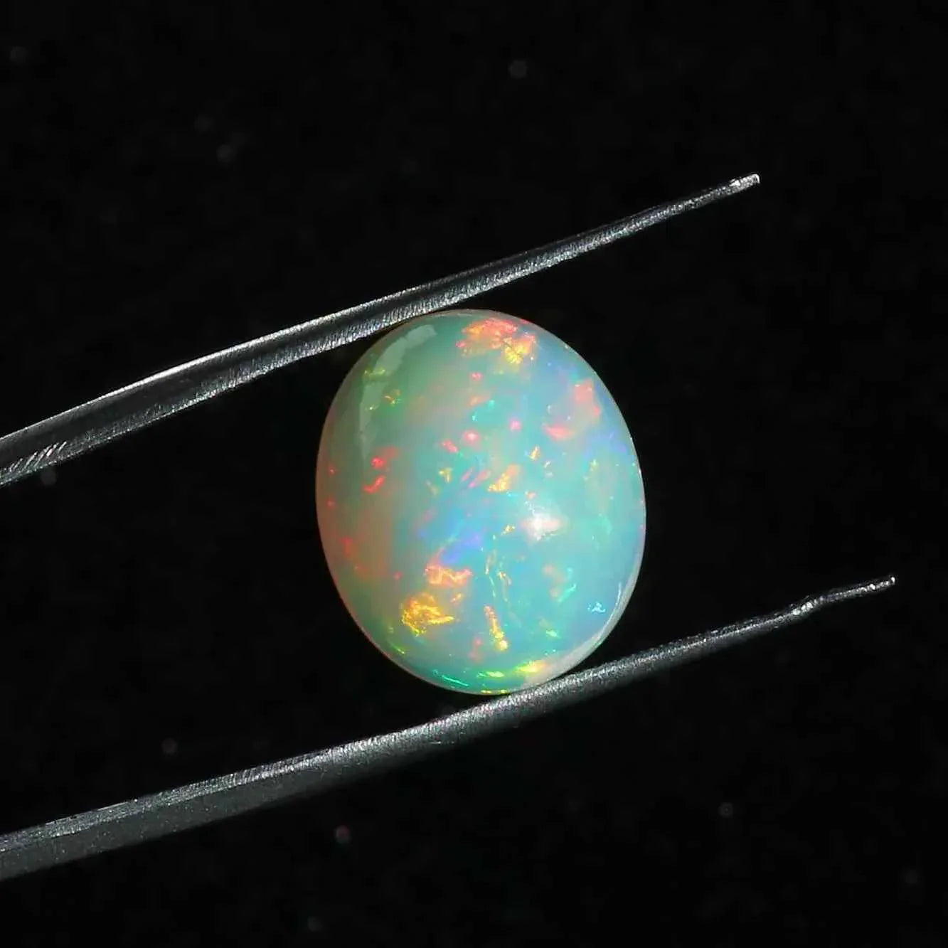 Ethiopian Opal Cabochon: 7.63 Carat Oval Fire Opal Gemstone loose gemstones