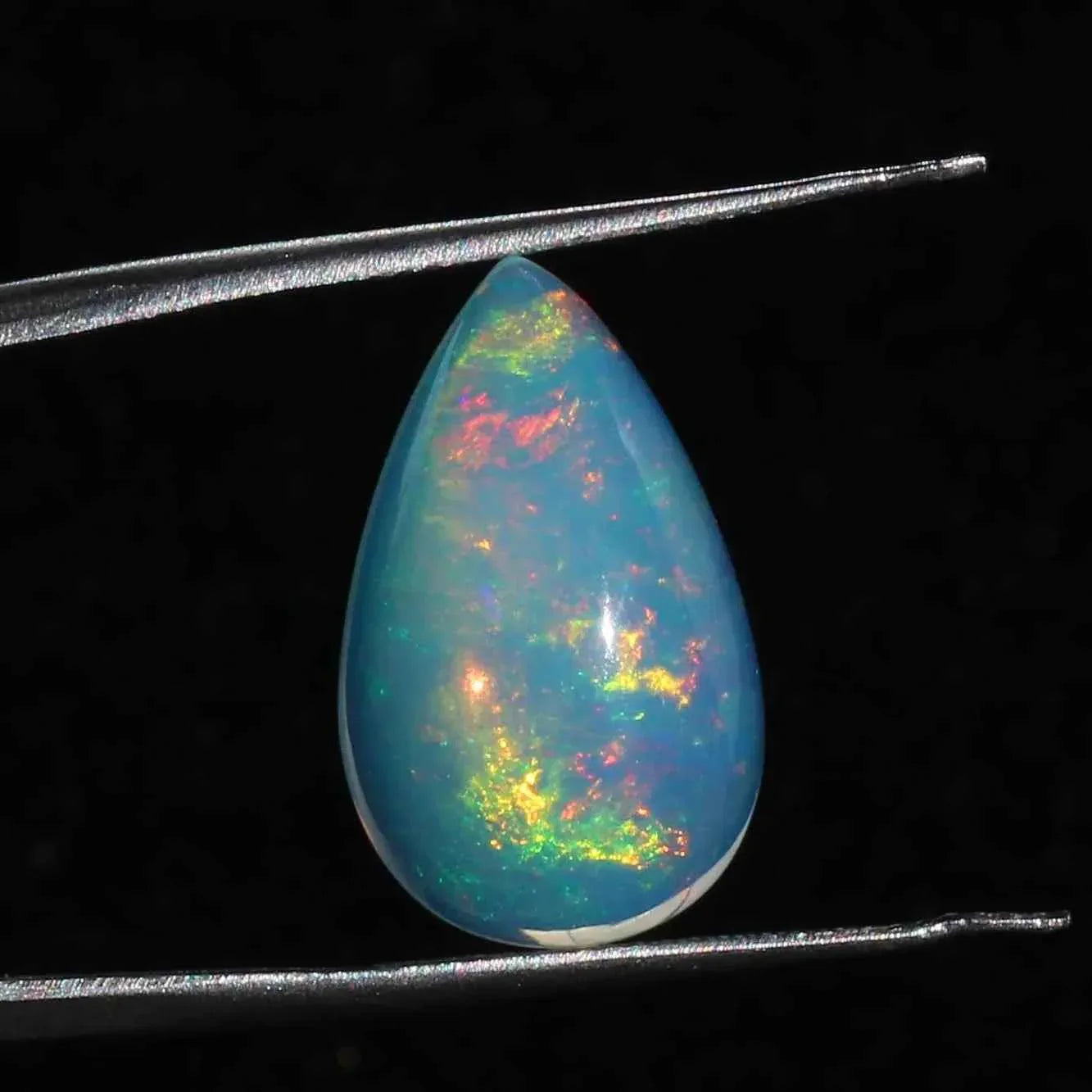 Ethiopian Welo Opal Cabochon: Rainbow Fire Pear-Shape Gemstone, 6.91 CT loose gemstones