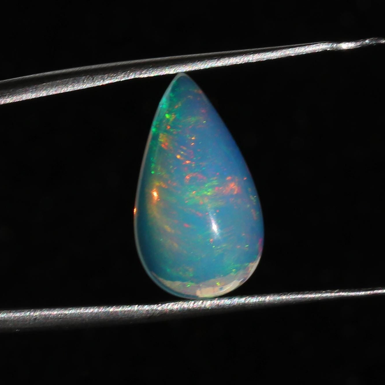 Ethiopian Welo Opal Cabochon: Rainbow Fire Pear-Cut Gemstone, 4.77 CT