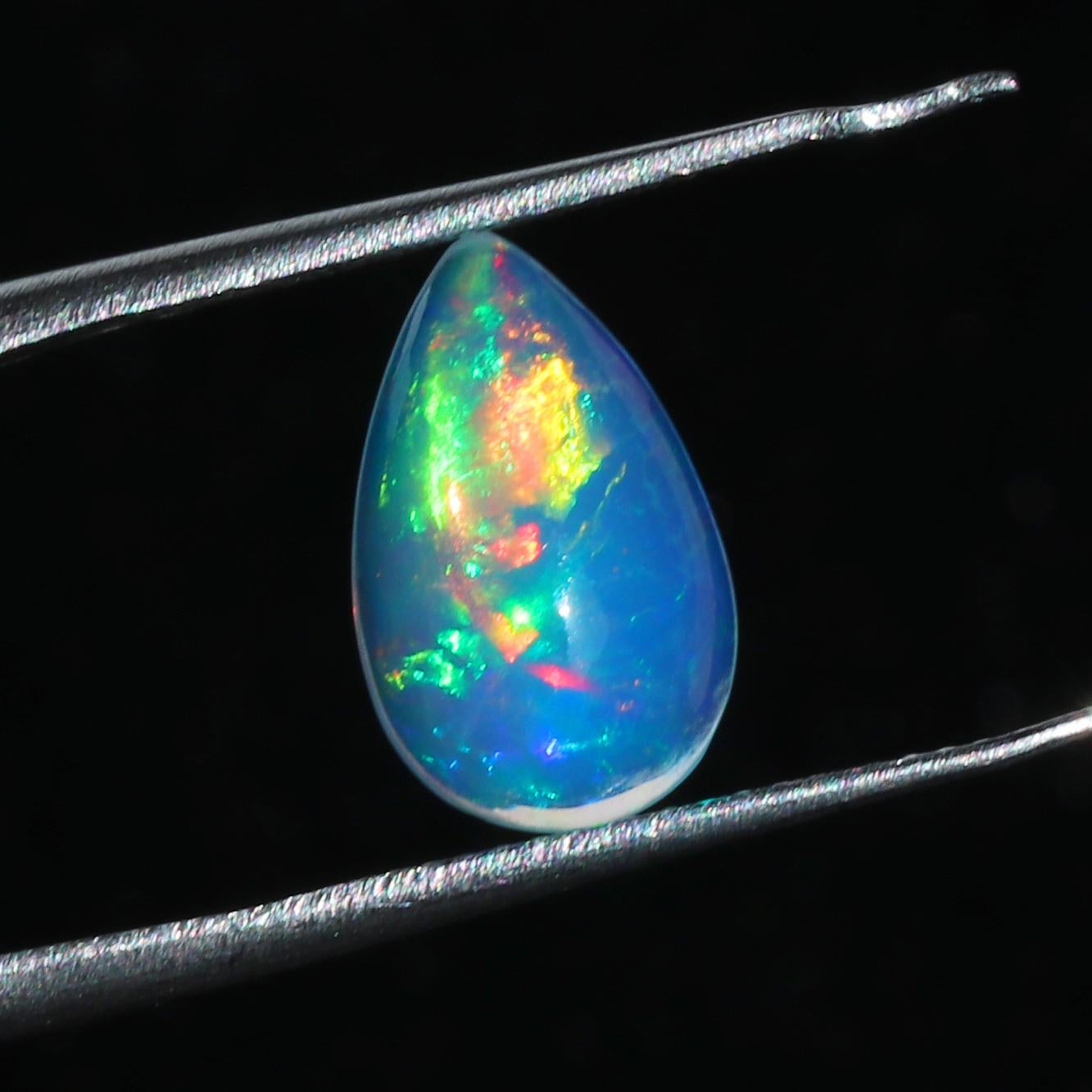 Welo Ethiopian Fire Opal Cabochon: Rainbow Gemstone for Jewelry (1.67 Cts, 13x8 mm
