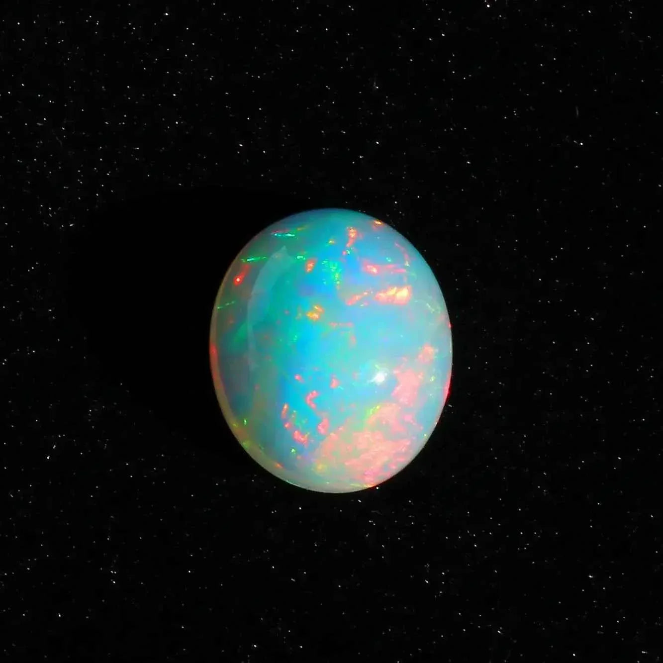 Ethiopian Opal Cabochon: 7.63 Carat Oval Fire Opal Gemstone loose gemstones
