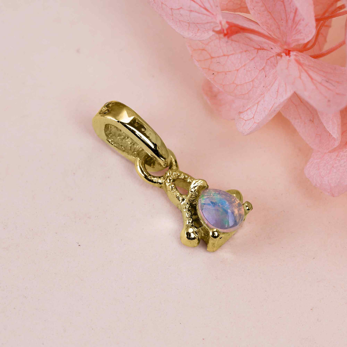 Natural opal pear pendant on sterling silver chain, delicate Himalayan Quartz opal necklace, showcasing a tiny, colorful opal gemstone.