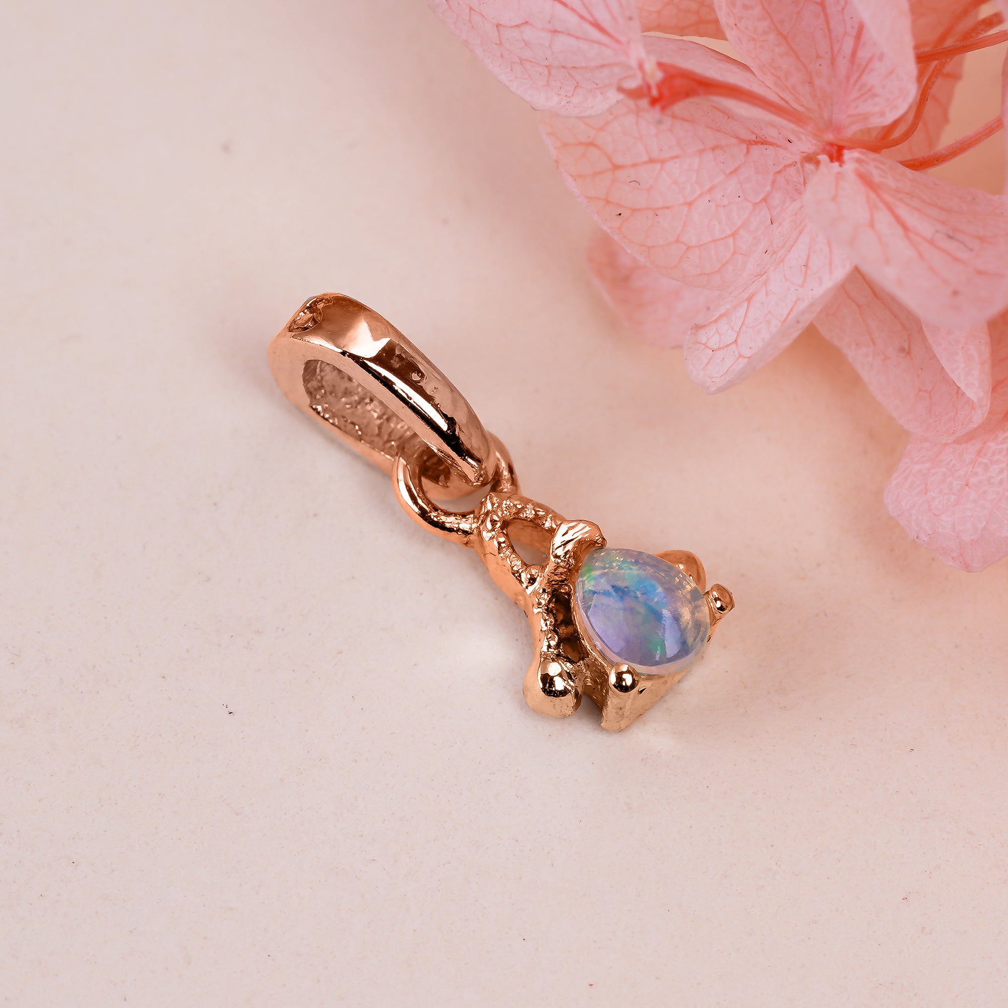 Natural opal pear pendant necklace featuring a tiny opal gemstone set in sterling silver, from Himalya Quartz.