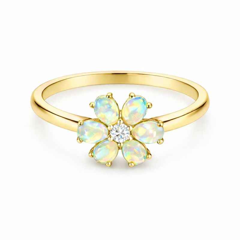 White Ethiopian Opal Zircon ring featuring a 3x5mm oval cabochon set in sterling silver with a halo style design.