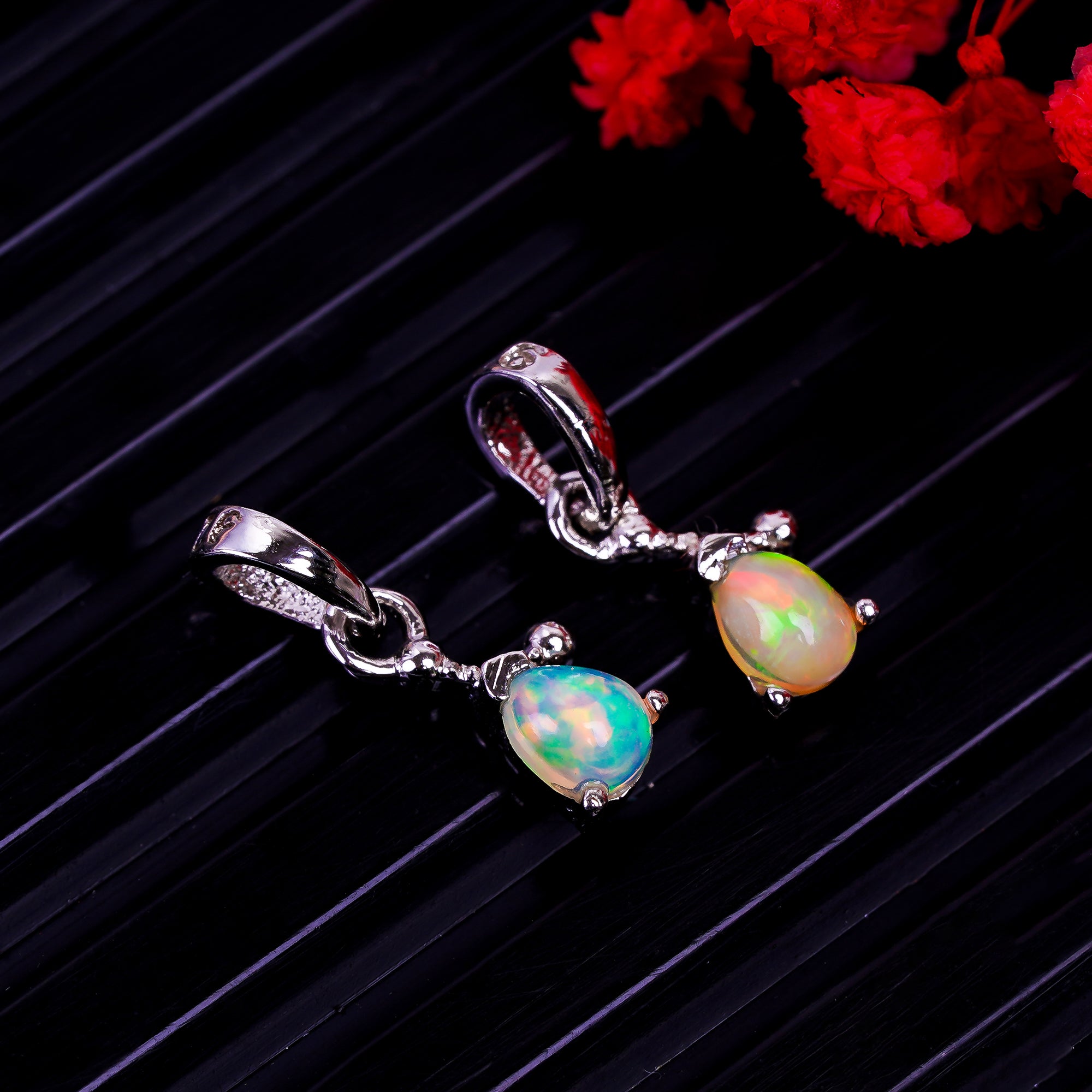 Himalya Quartz opal pear pendant necklace in sterling silver featuring a pear-shaped October birthstone cabochon.