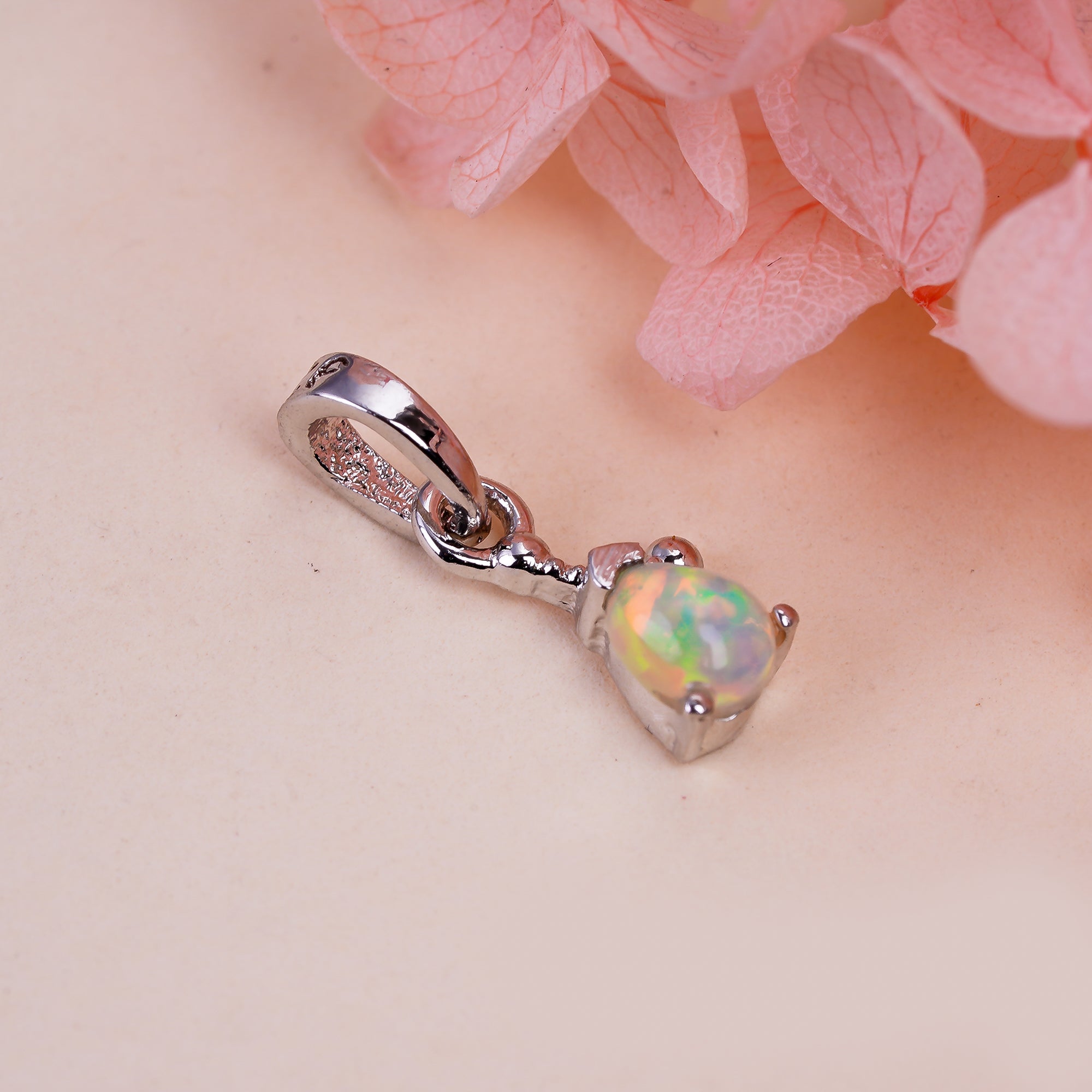 Himalya Quartz opal pendant necklace with a pear-shaped October birthstone cabochon in 925 sterling silver.