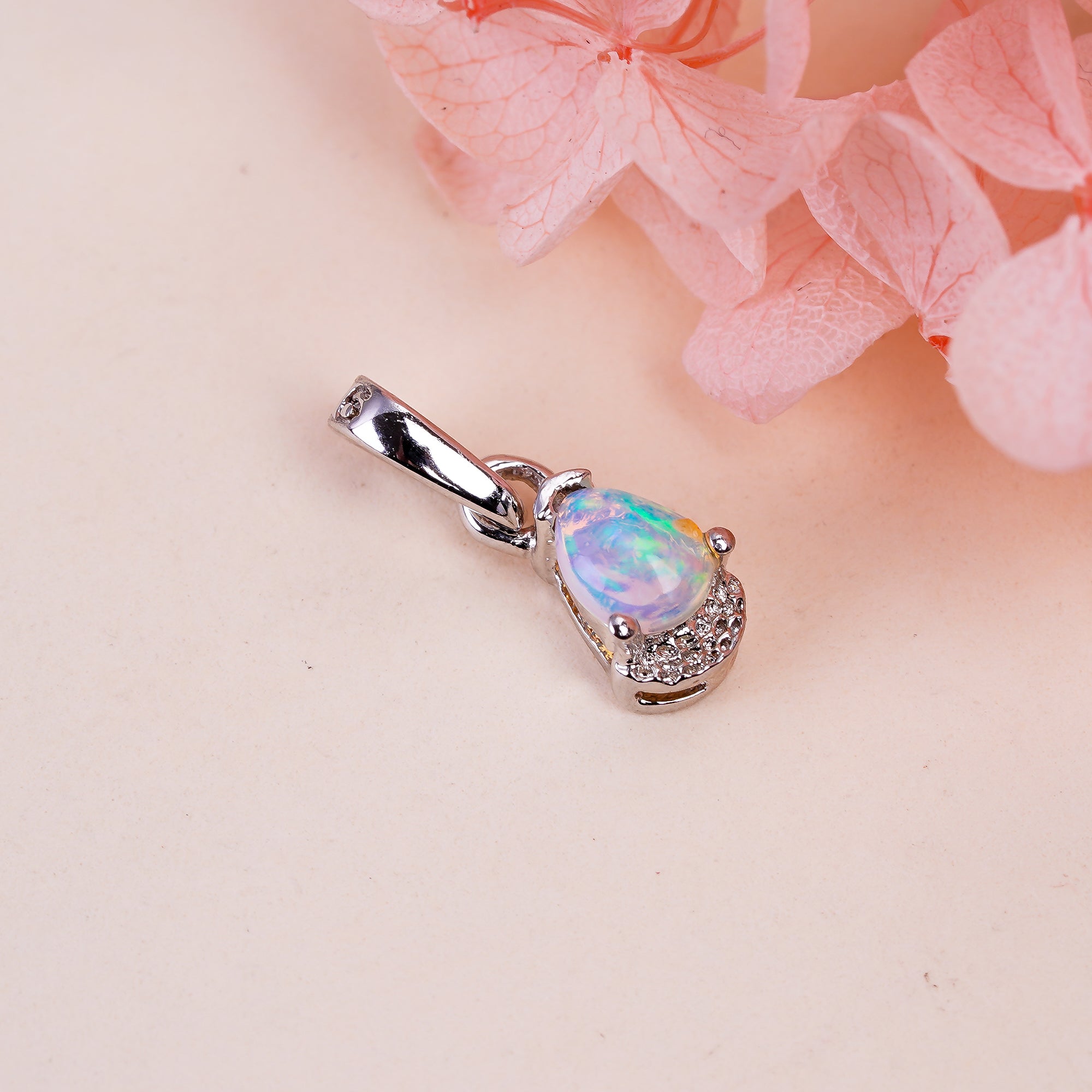 Natural opal pear pendant on 925 sterling silver chain by Himalya Quartz, minimalist design perfect for elegant jewelry.