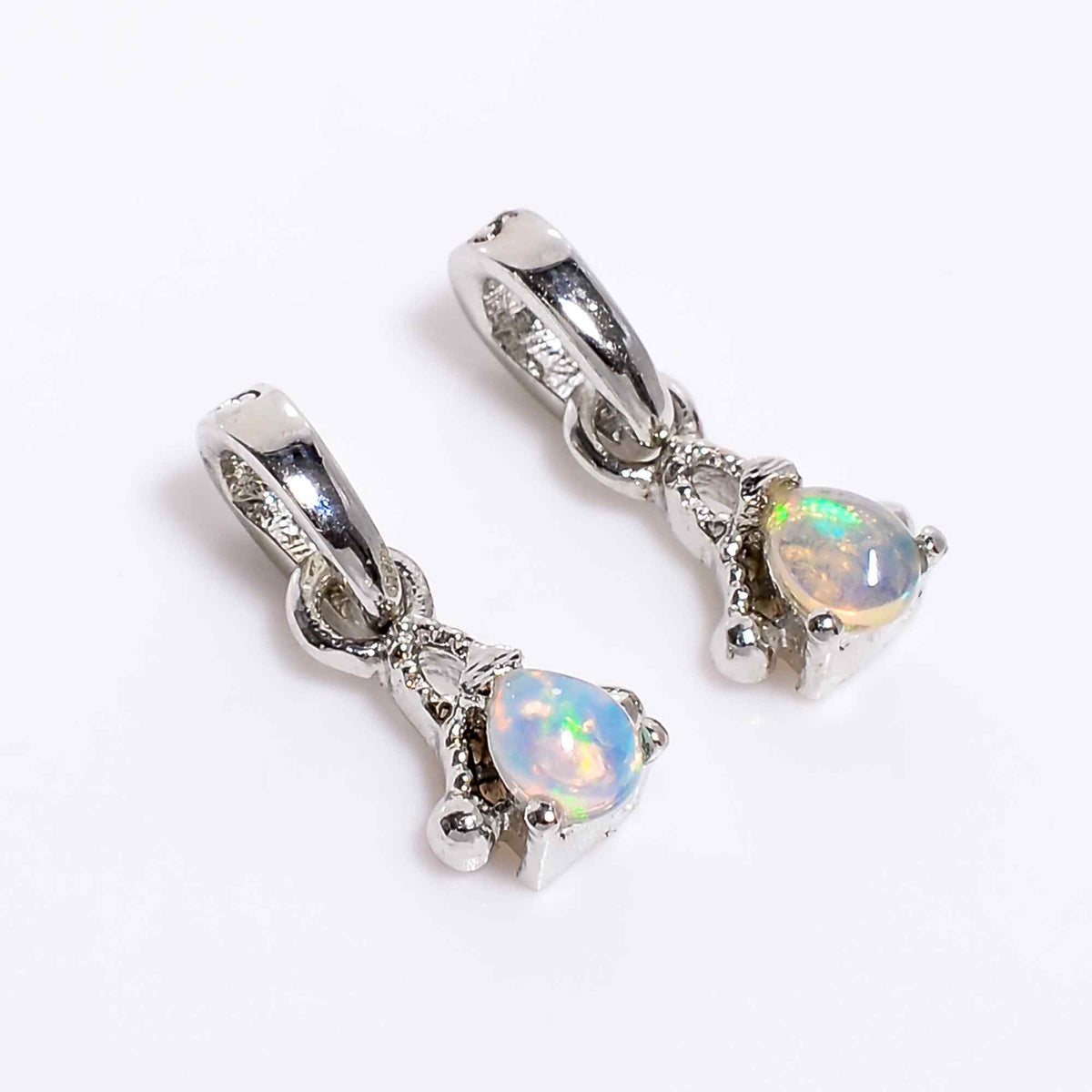 Natural opal pear pendant necklace with 925 sterling silver setting, featuring a tiny opal gemstone by Himalya Quartz.