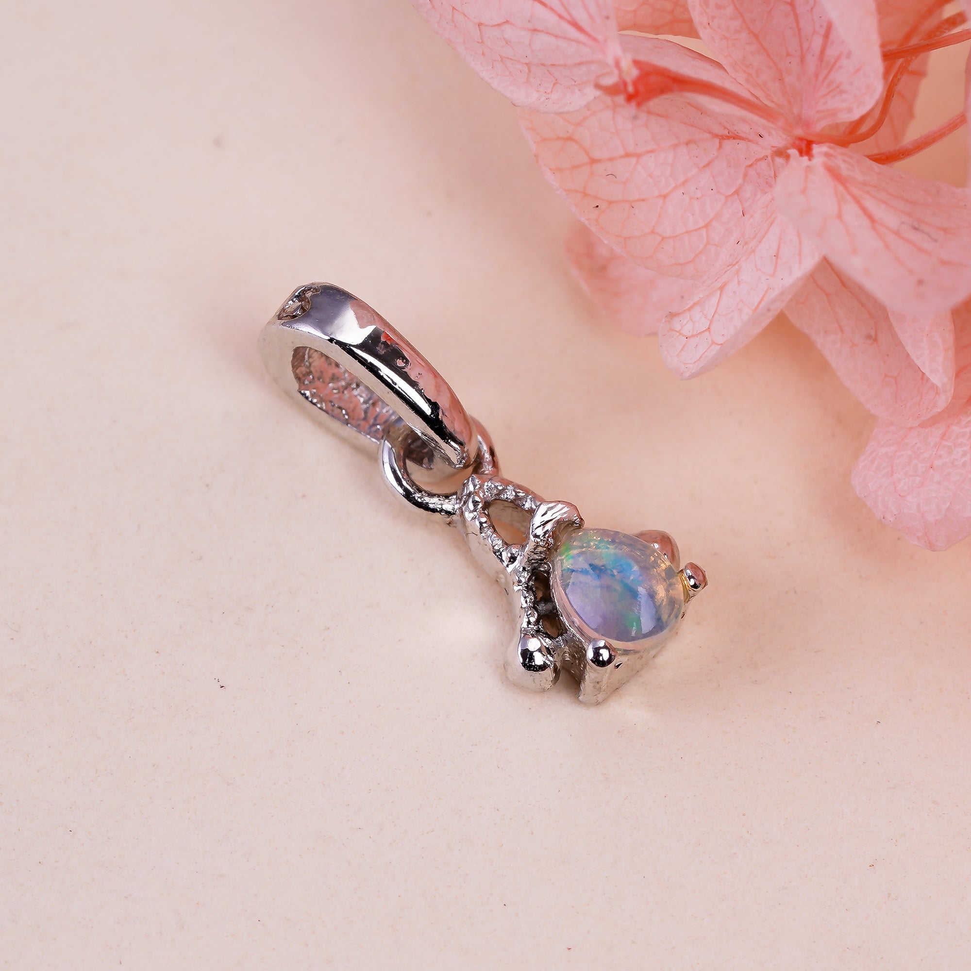Natural opal pear pendant in 925 sterling silver, featuring a tiny opal gemstone, from Himalya Quartz jewelry collection.