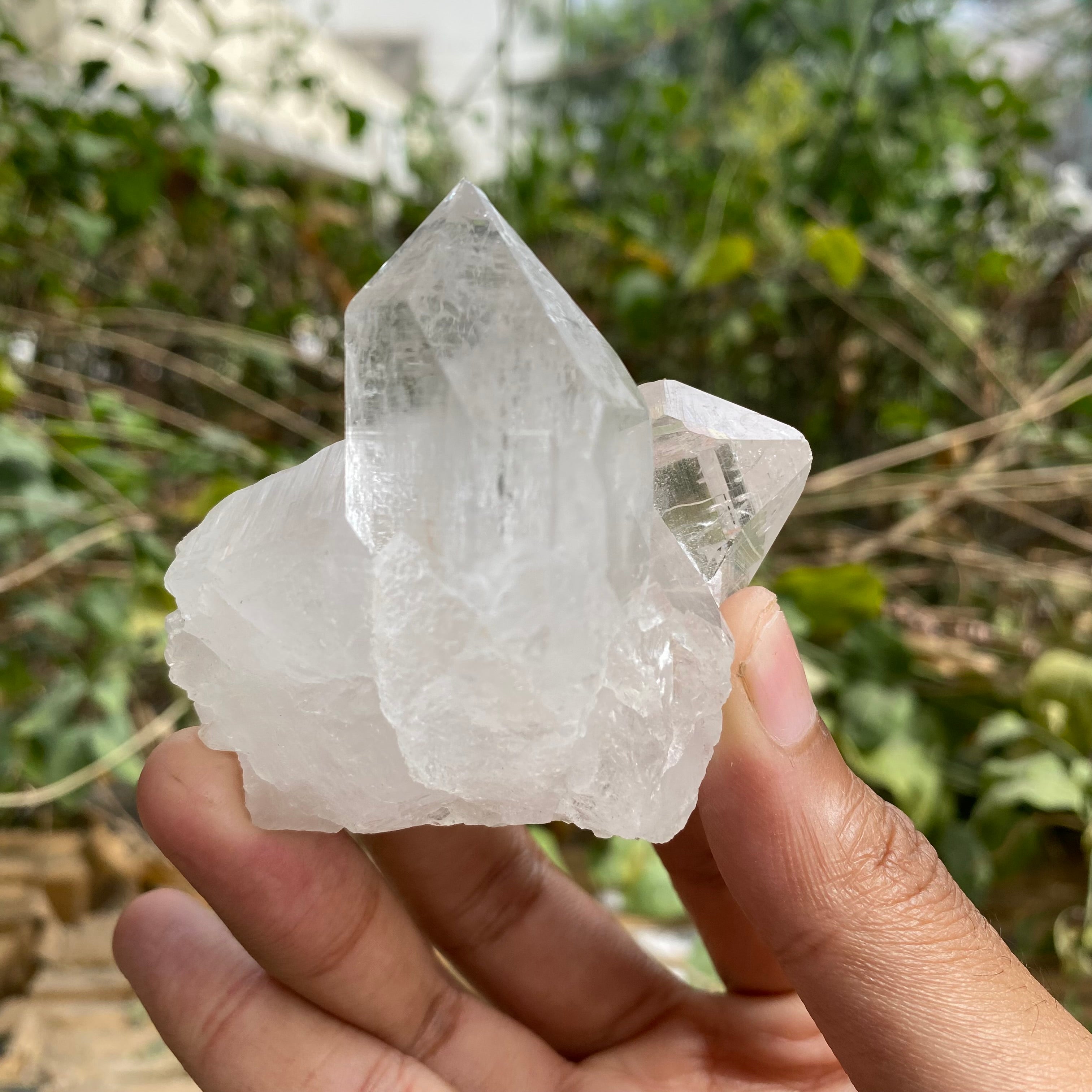 White Himalayan Quartz crystal cluster, natural healing stone mineral specimen with raw, unpolished appearance for home décor.