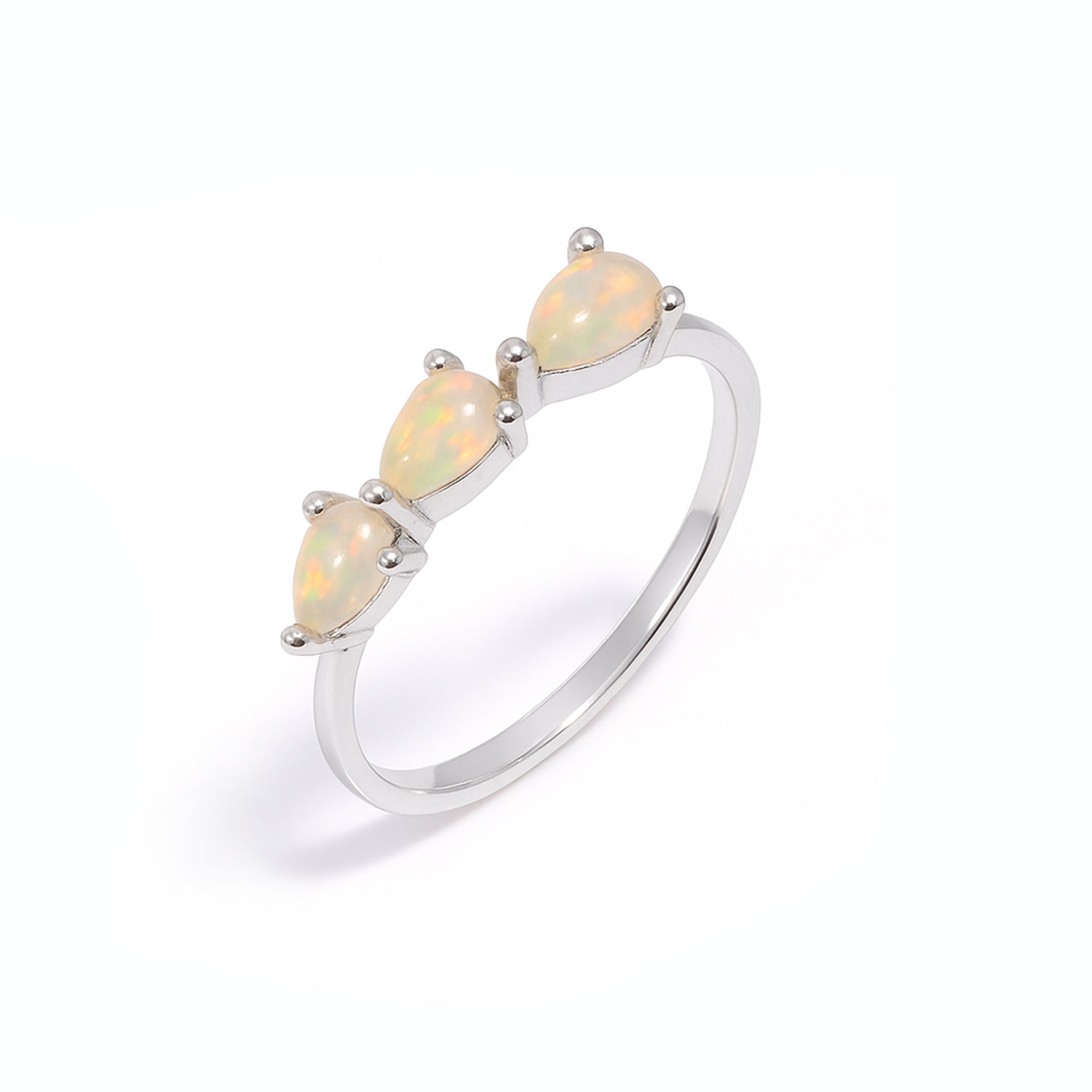 Three stone Ethiopian opal ring featuring 3x5mm pear-shaped opals set in sterling silver, handmade boho jewelry for women.