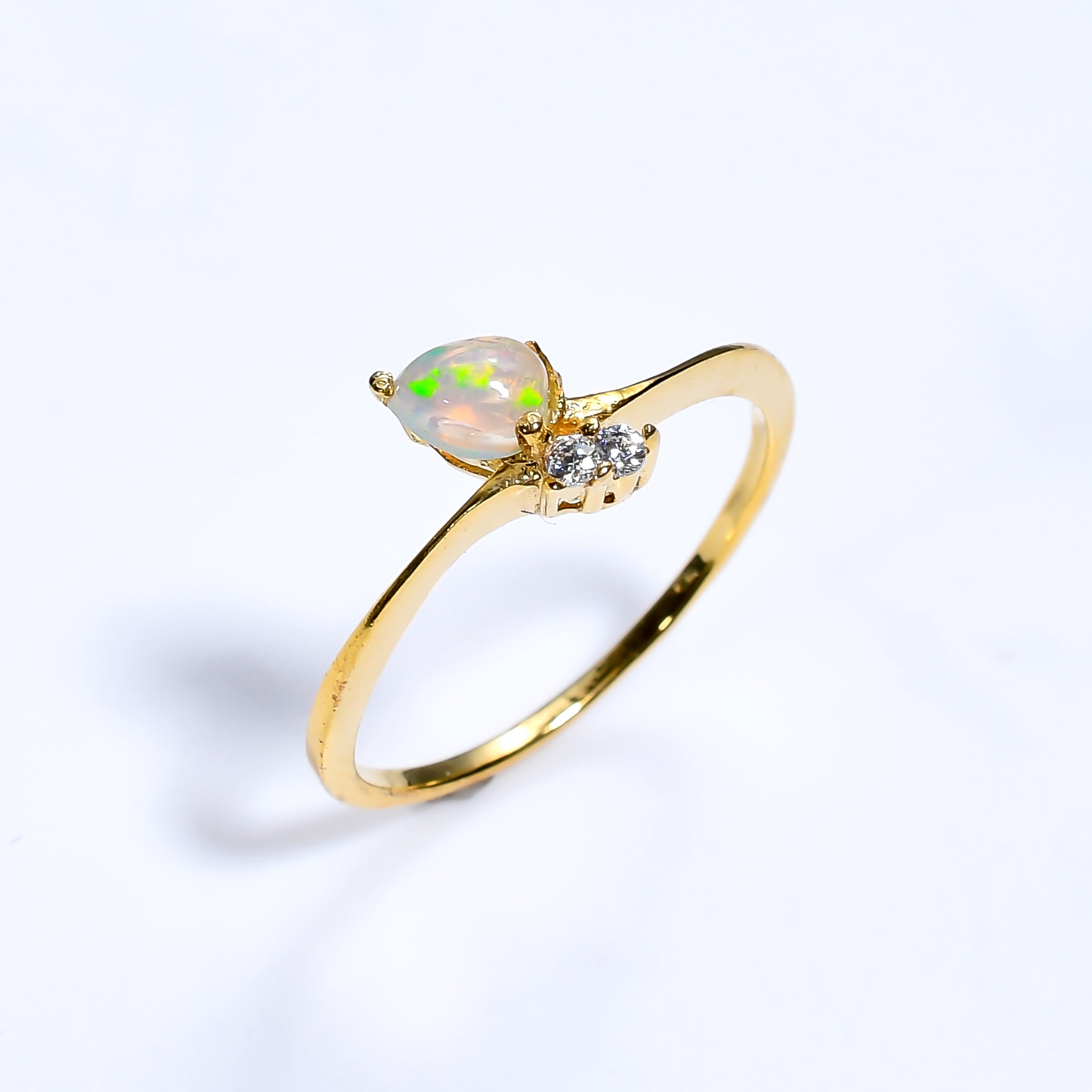 Sterling silver ring with pear-cut Ethiopian opal zircon gemstone, minimalist design, suitable for women.