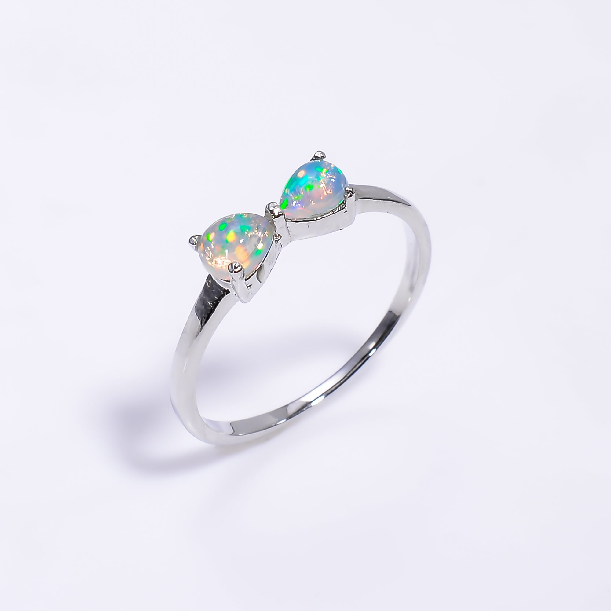 Natural Ethiopian opal ring in 925 sterling silver with pear-shaped opal, minimalist handmade gemstone jewelry.