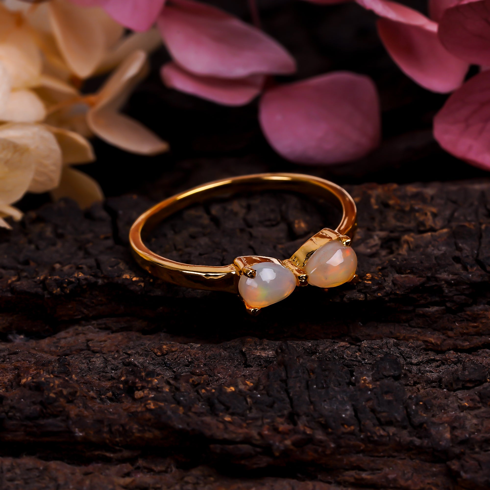 Natural Ethiopian opal ring in 925 sterling silver with a pear-shaped opal, minimalist handmade gemstone jewelry by Himalya Quartz.
