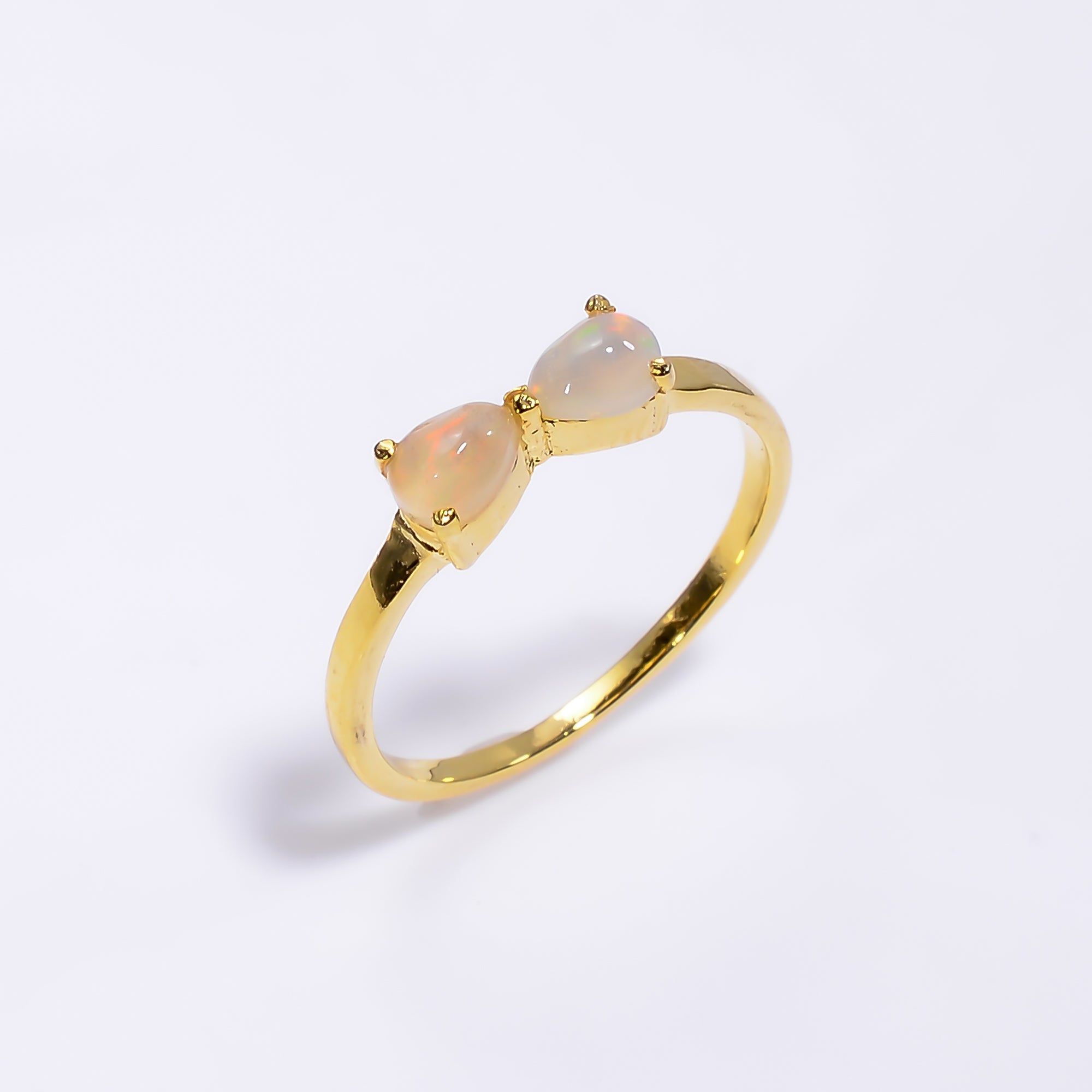 Natural Ethiopian Opal ring in 925 sterling silver with a pear-shaped opal, minimalist handmade gemstone jewelry by Himalya Quartz.