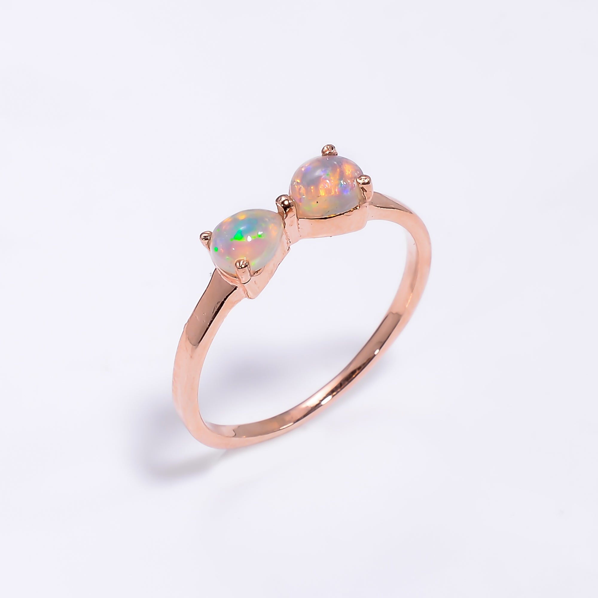Natural Ethiopian Opal ring in 925 sterling silver with a pear-shaped opal gemstone, minimalist handmade jewelry by Himalya Quartz.