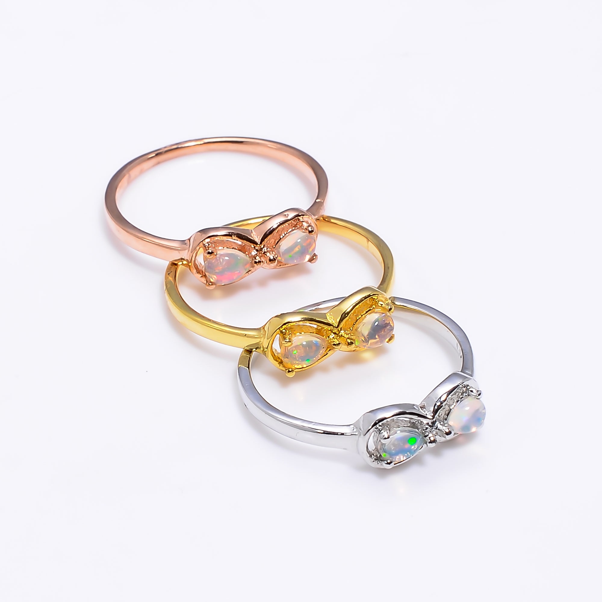 Natural Ethiopian opal pear ring in 925 sterling silver with 3x4mm opal gemstone, designed for women.