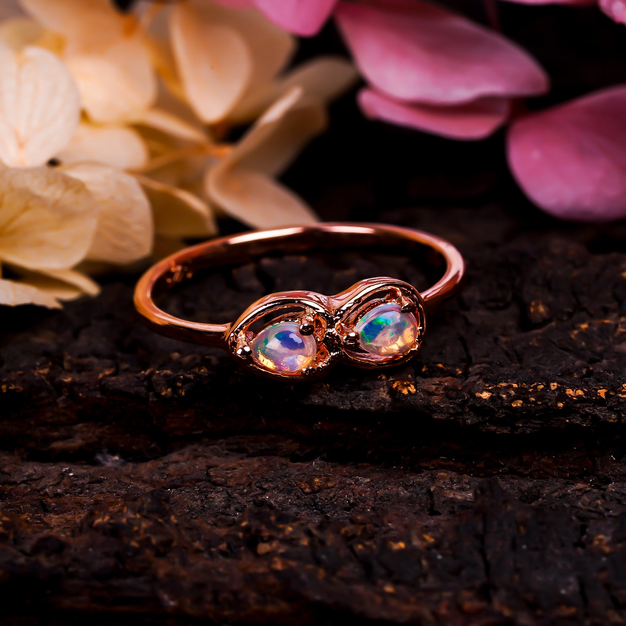 Ethiopian opal ring in 925 sterling silver featuring a pear-shaped 3x4mm opal, handcrafted jewelry for women.