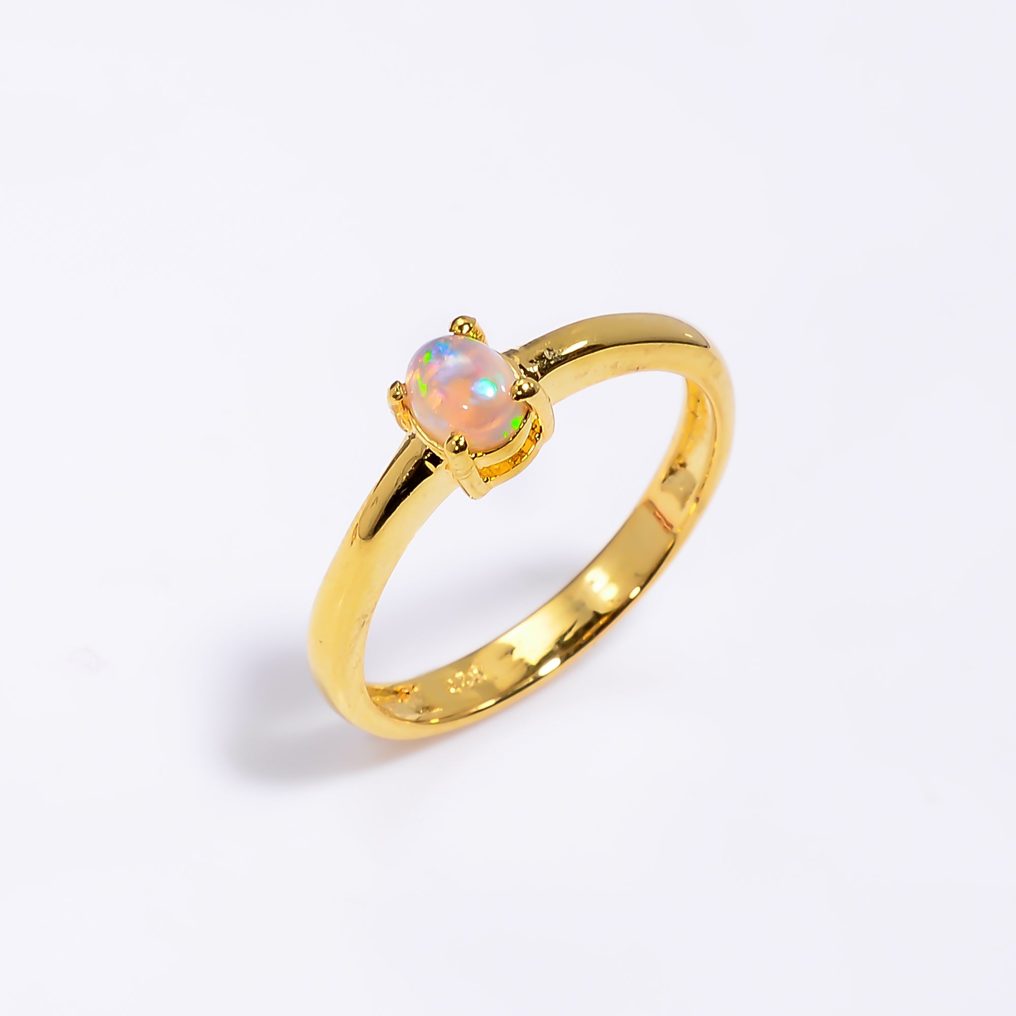 Oval Ethiopian Opal ring in 925 sterling silver with a handmade 3x5mm opal, designed for women.