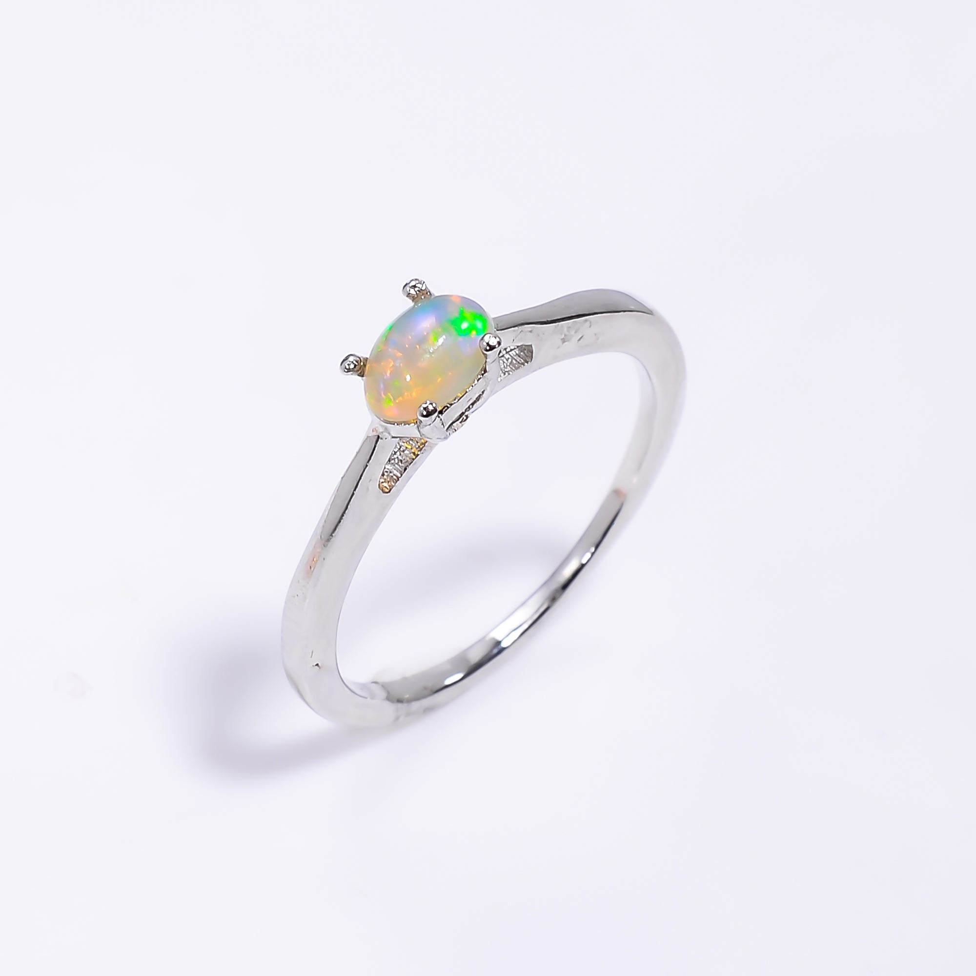Ethiopian fire opal ring for women with 925 sterling silver band, featuring natural October birthstone and elegant design.