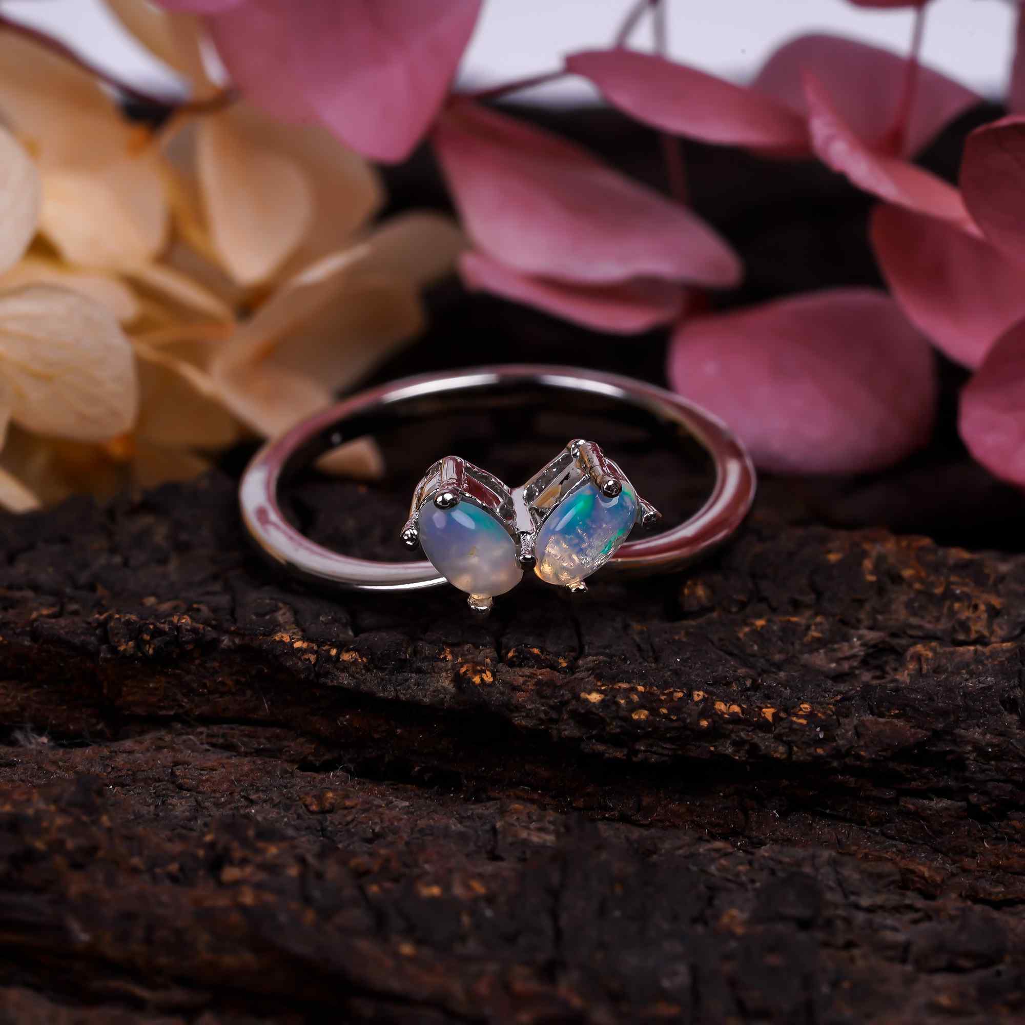 Natural Ethiopian opal stud earrings with 3x5mm oval cabochon set in sterling silver from Himalya Quartz.