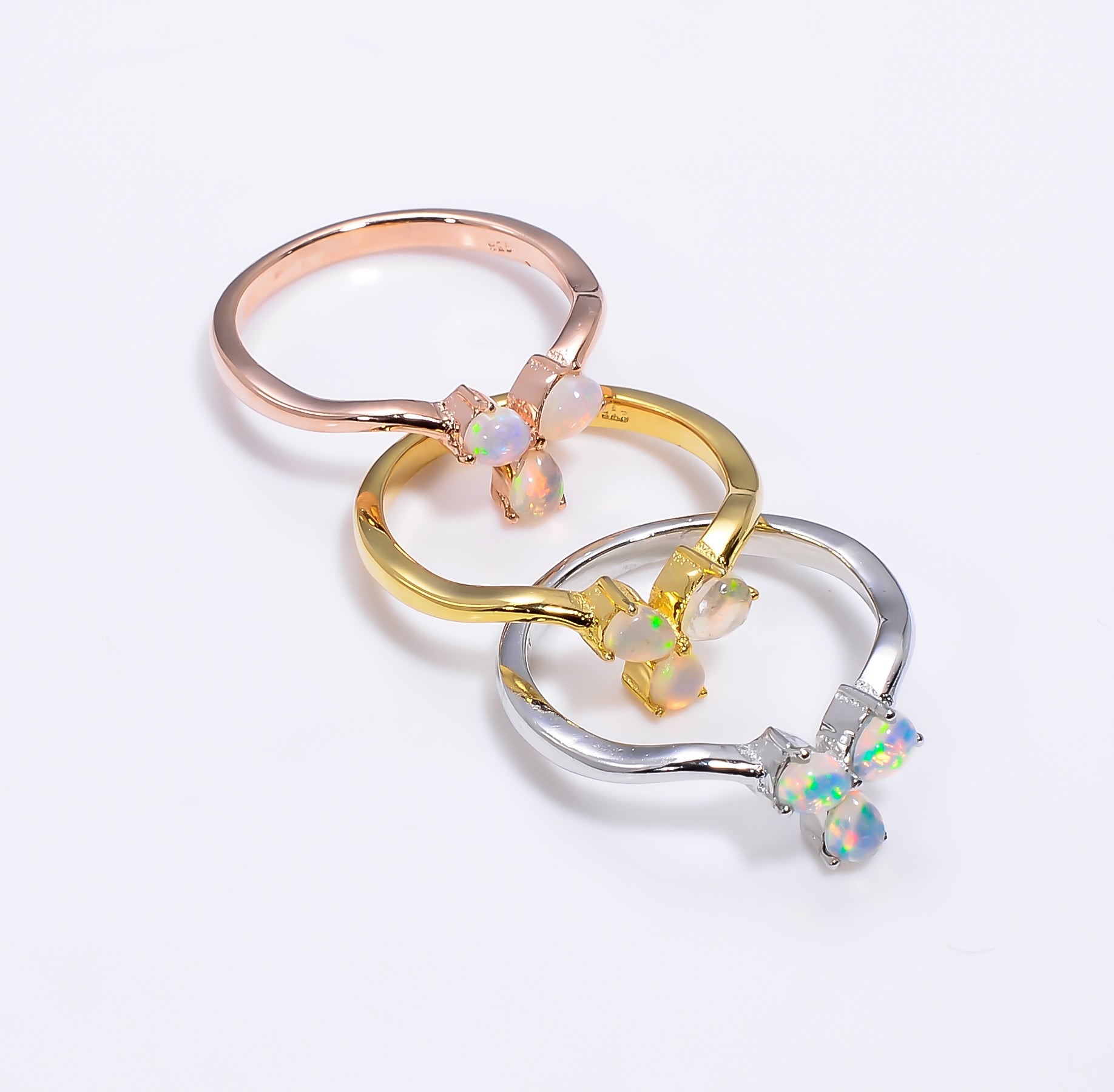Handmade Ethiopian opal ring in 925 sterling silver featuring a 3x4mm pear-shaped fire opal for women.