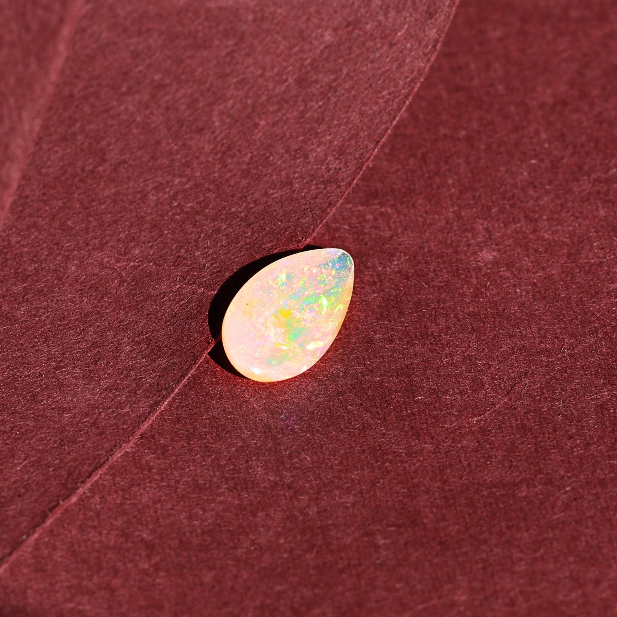 AAA+ Quality White Ethiopian Opal Cabochon: 2.25 Carat Pear-Shaped Gemstone