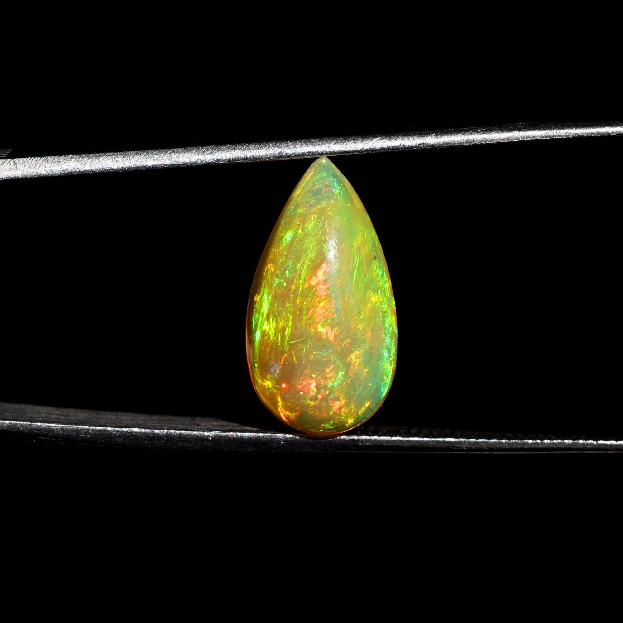 Natural AAA+ Grade White Ethiopian Opal Rainbow Fire Pear Shape Gemstones Wholesaler 4.15 Carat