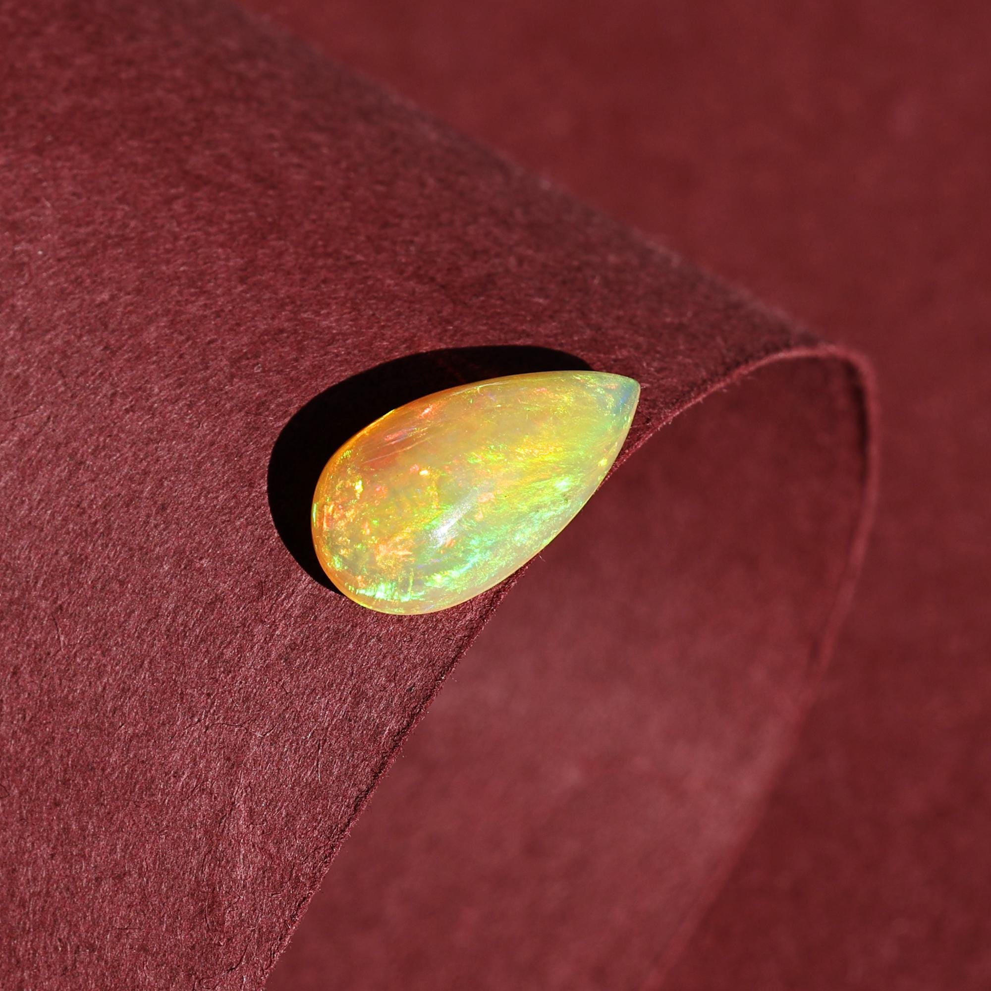 Natural AAA+ Grade White Ethiopian Opal Rainbow Fire Pear Shape Gemstones Wholesaler 4.15 Carat