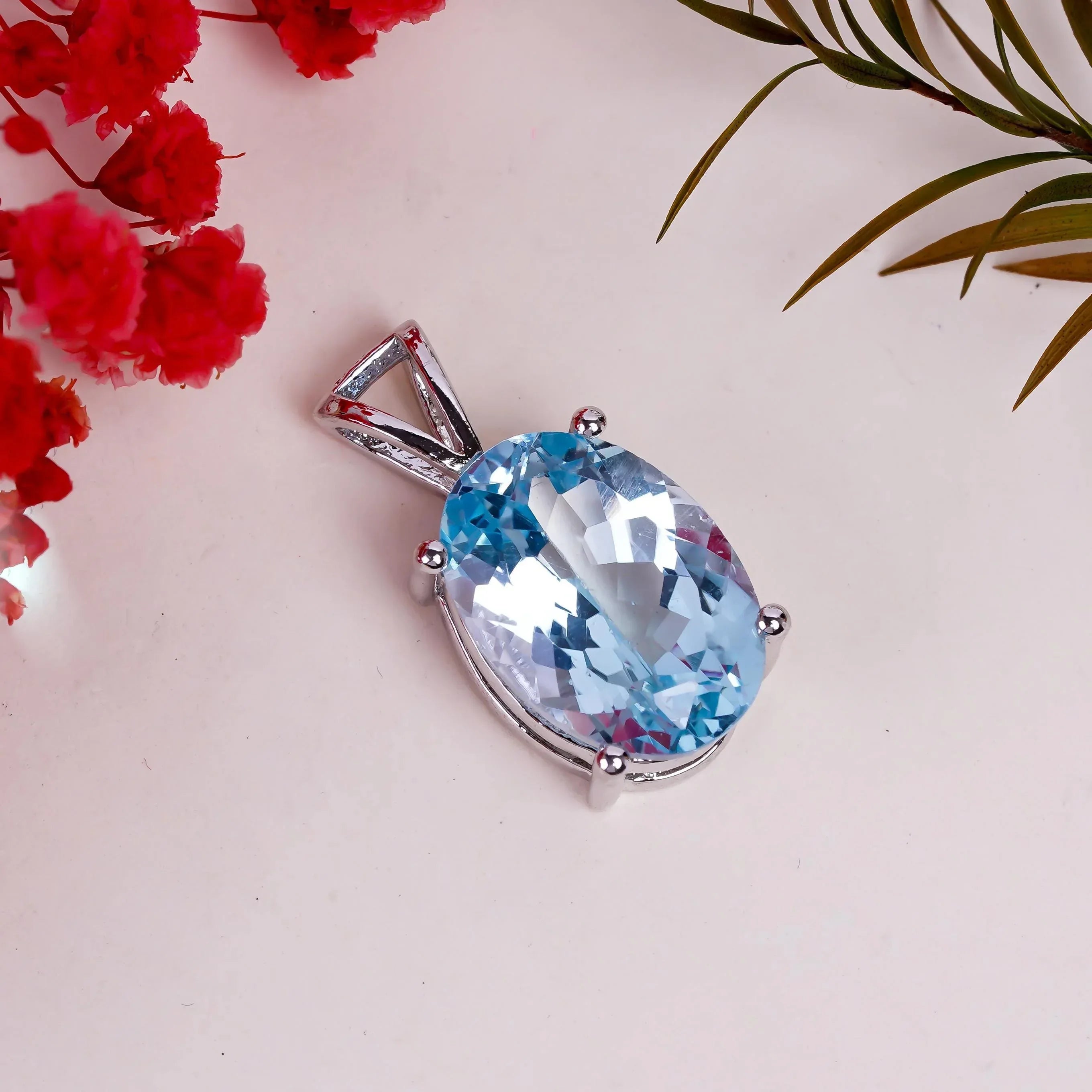 Handmade Oval Swiss Blue Topaz Pendant: Sterling Silver (10x14mm)